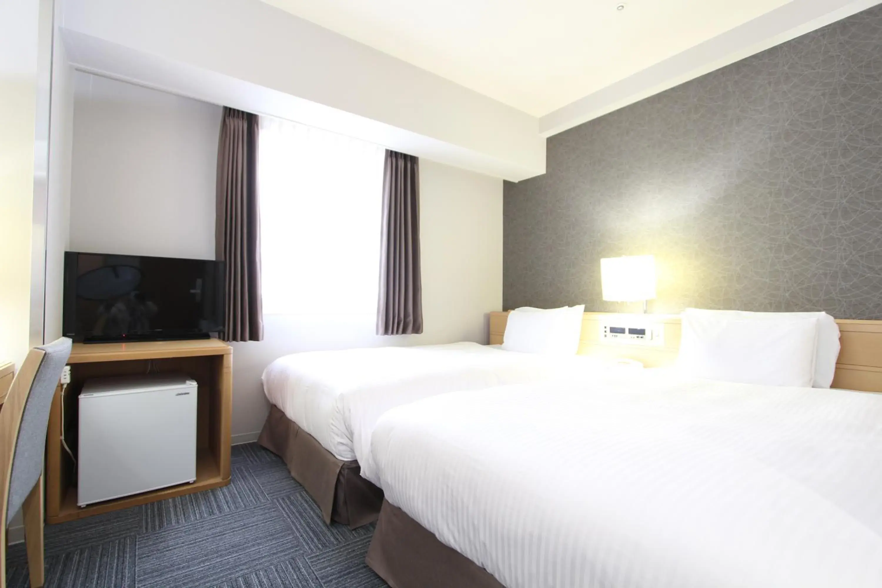 Bed in SureStay Plus Hotel by Best Western Shin-Osaka