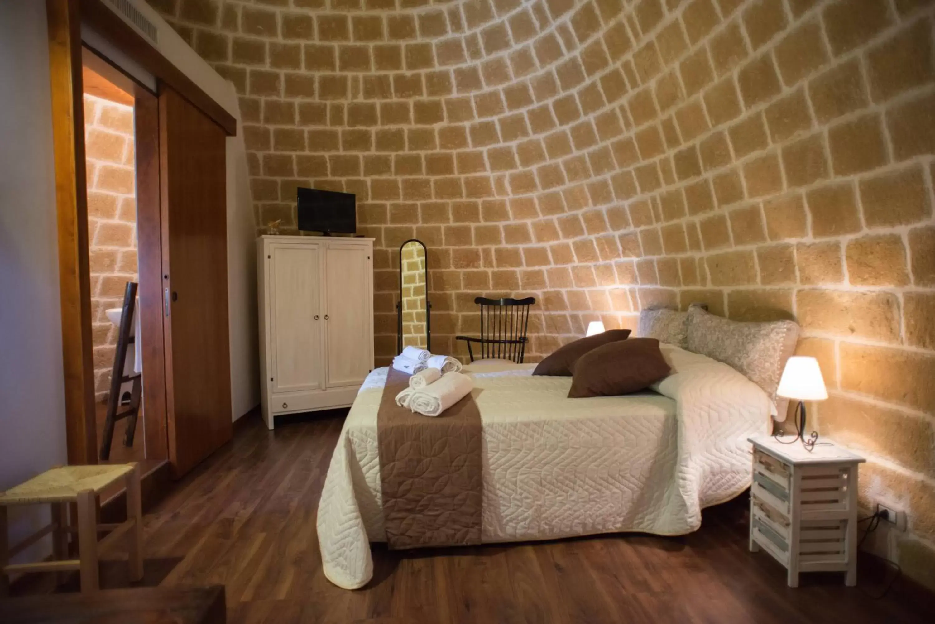 Bed in Grandi Trulli Bed & Breakfast