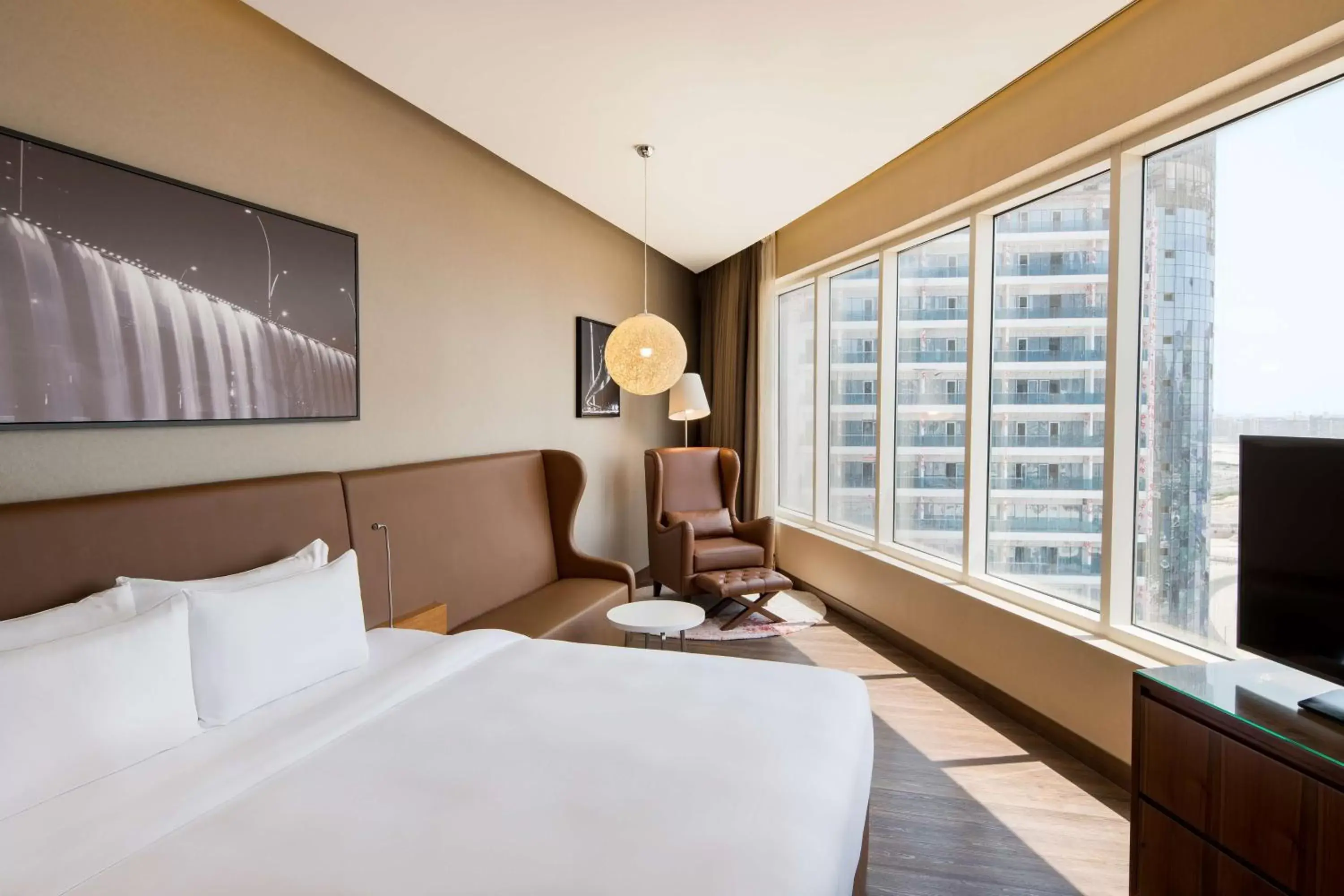 Bed in Radisson Blu Hotel, Dubai Canal View