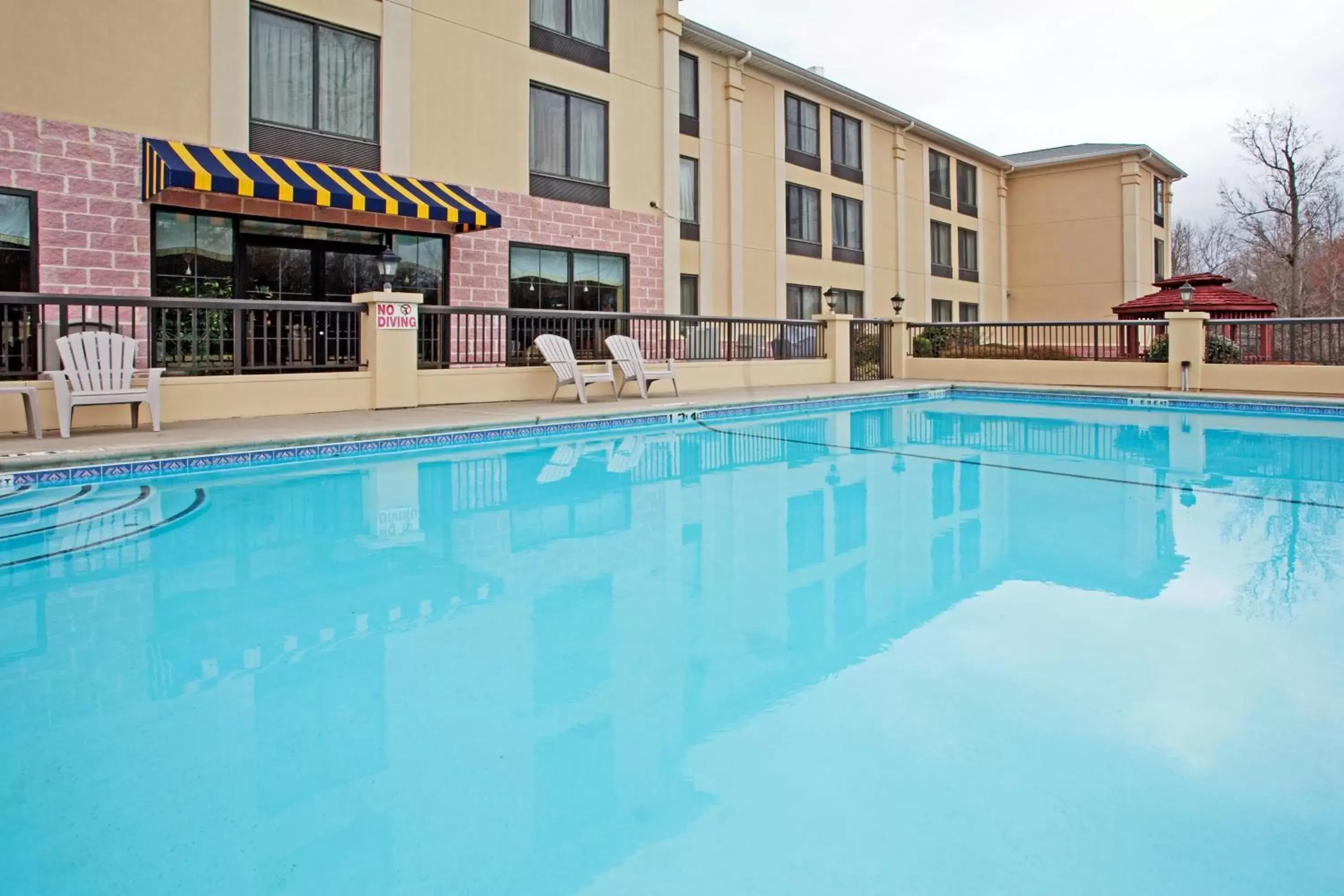 Swimming Pool in Holiday Inn Express Hotel & Suites Charlotte Airport-Belmont, an IHG Hotel