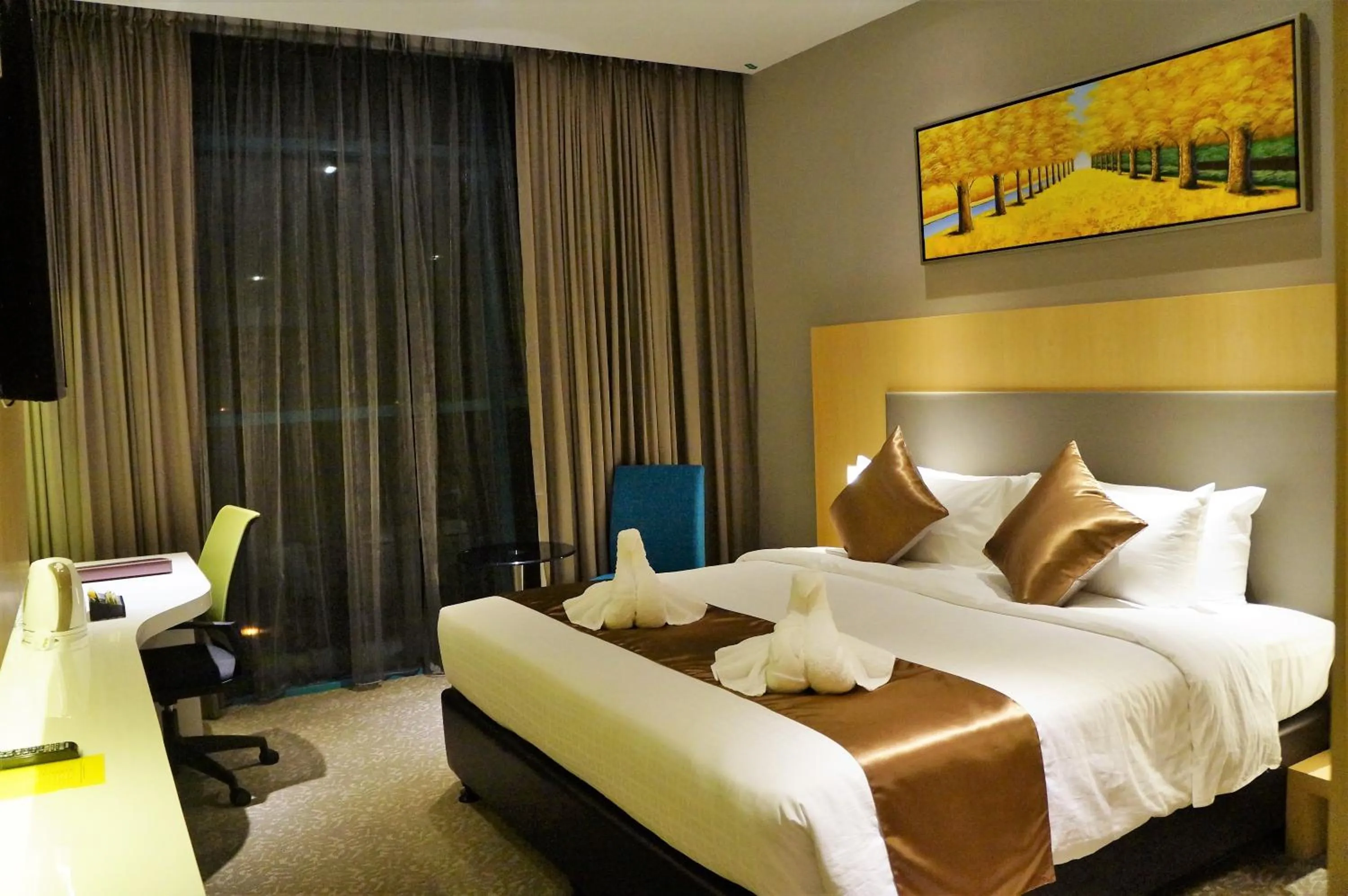 Bed in Greens Hotel & Suites