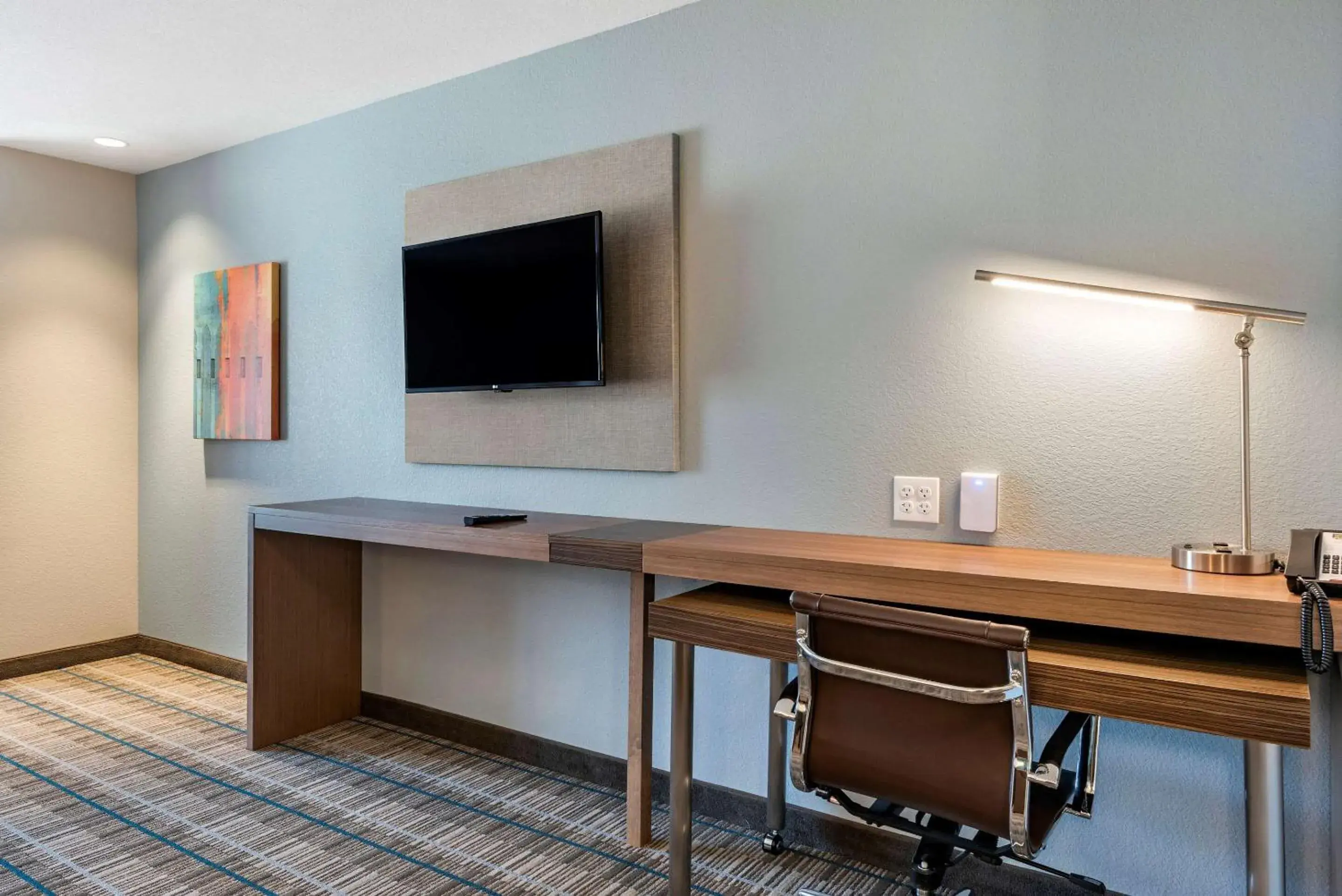 Photo of the whole room, TV/Entertainment Center in MainStay Suites Durango