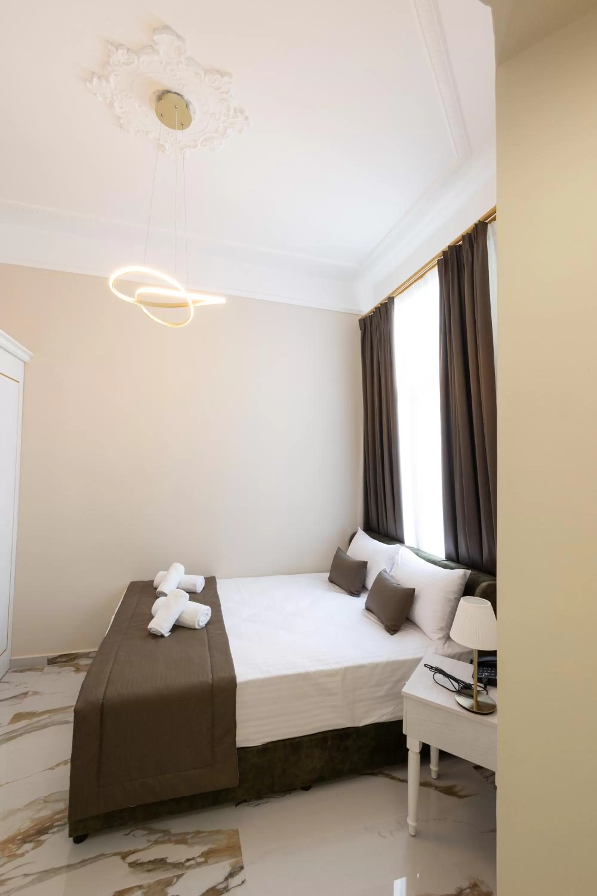 Bed in Modern Revival Luxury Hotel