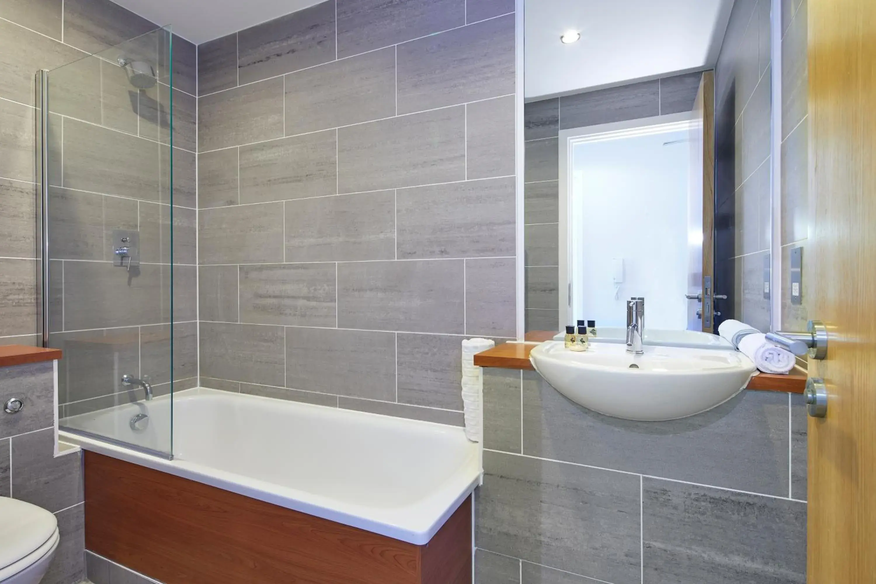 Bathroom in SACO Aparthotel Farnborough