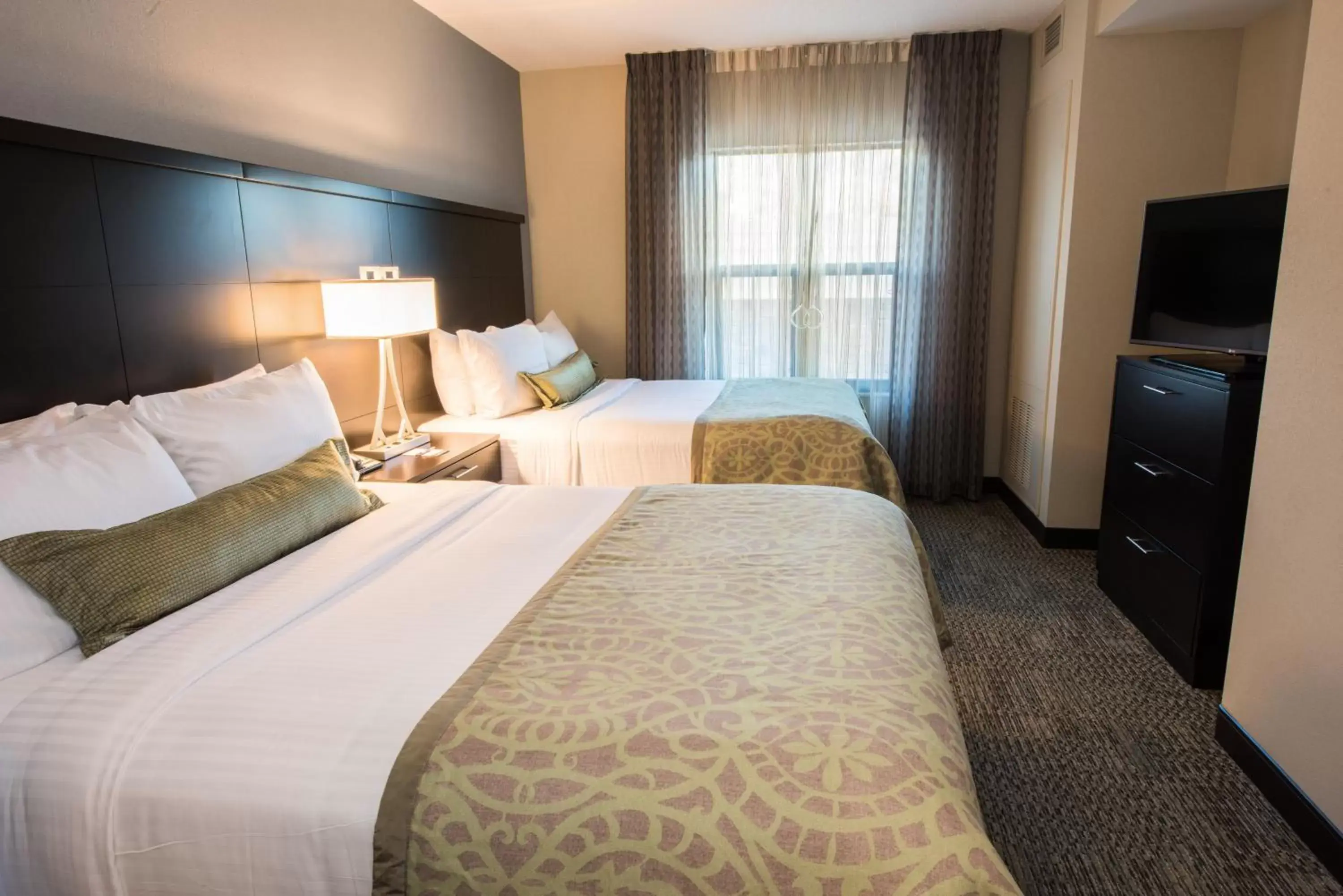 Photo of the whole room, Bed in Staybridge Suites Albany Wolf Rd-Colonie Center, an IHG Hotel