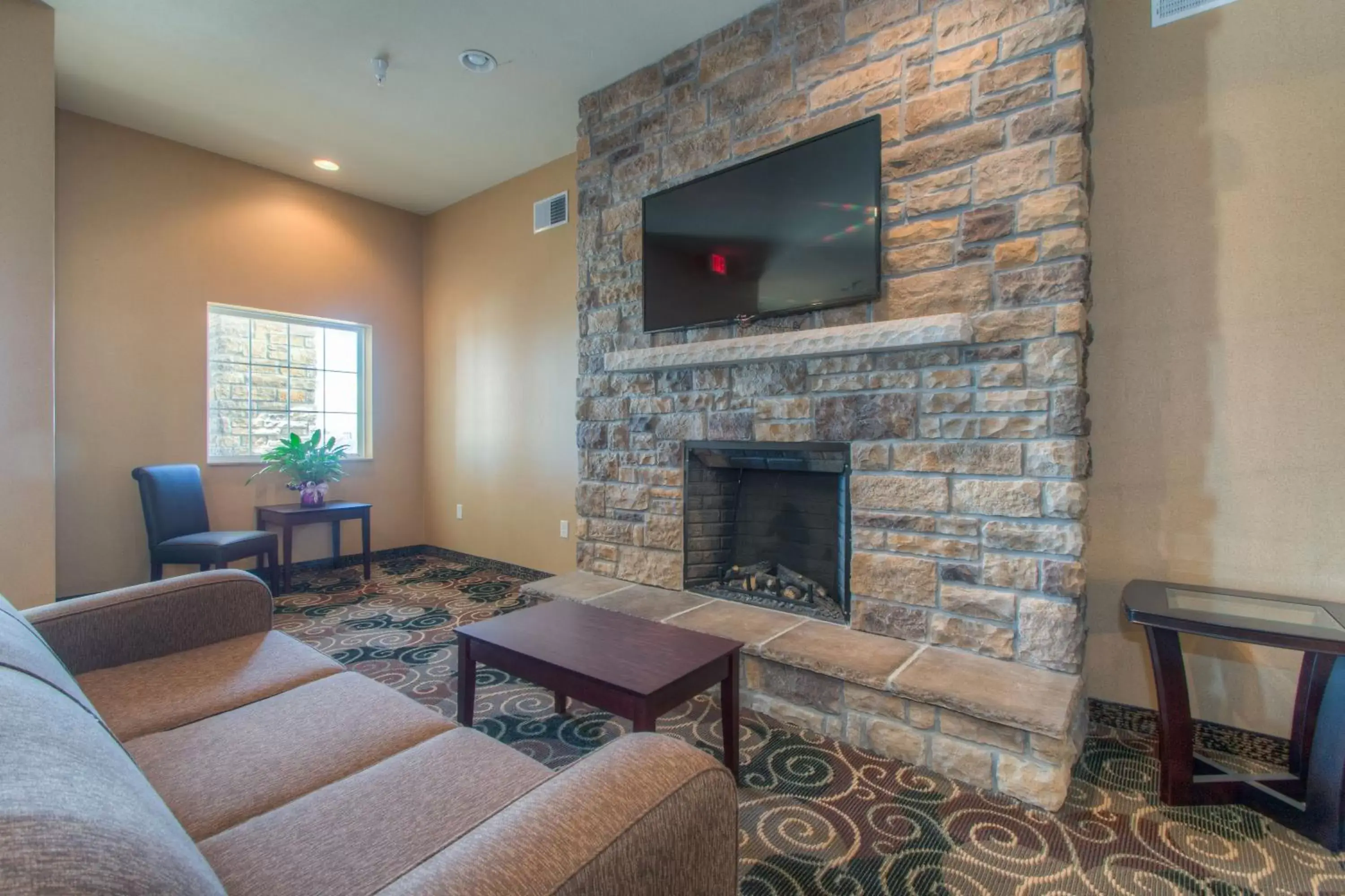 Communal lounge/ TV room, Seating Area in Cobblestone Inn & Suites - Wray