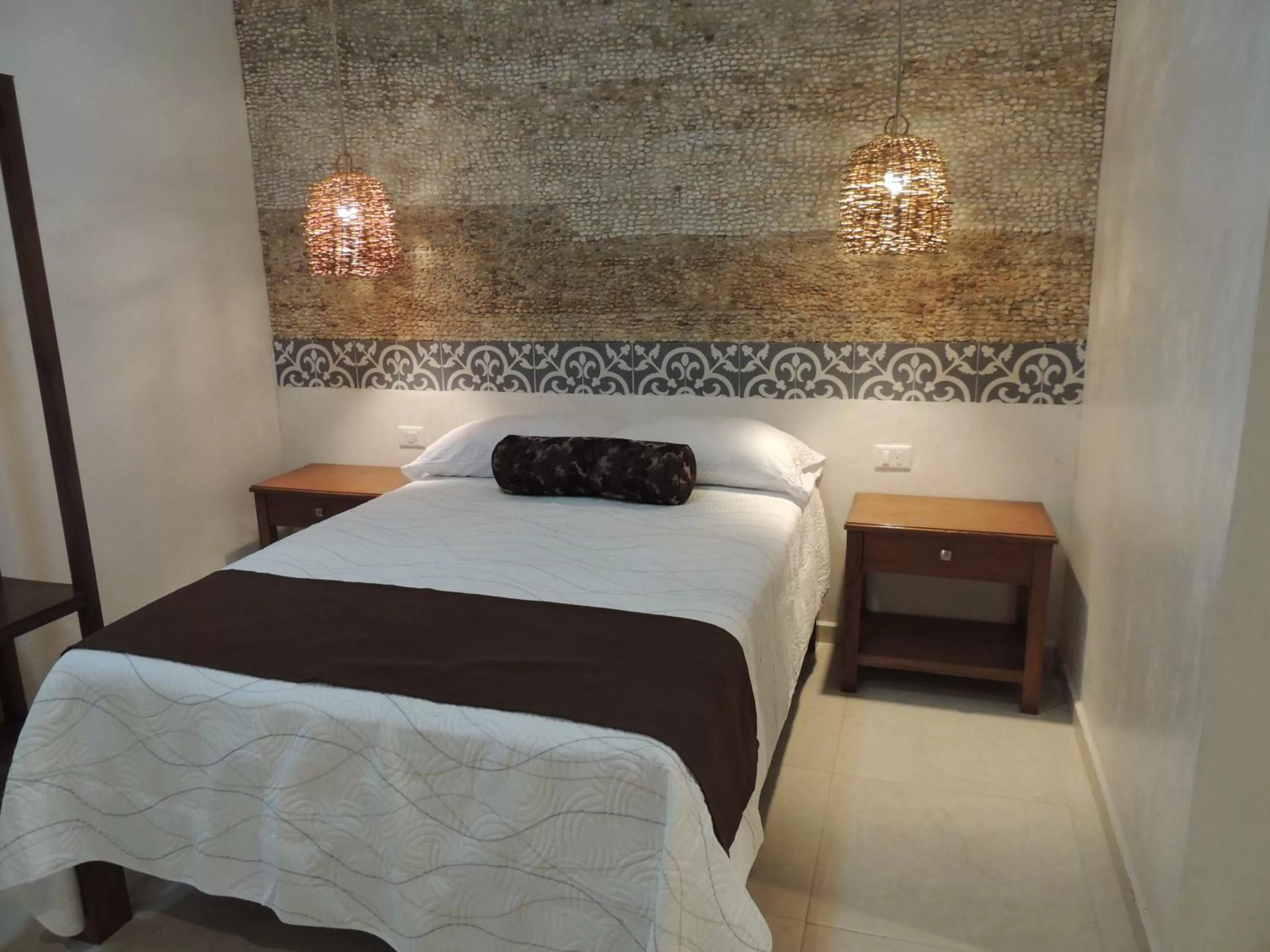 Bed in Hotel Boutique Bugambilias