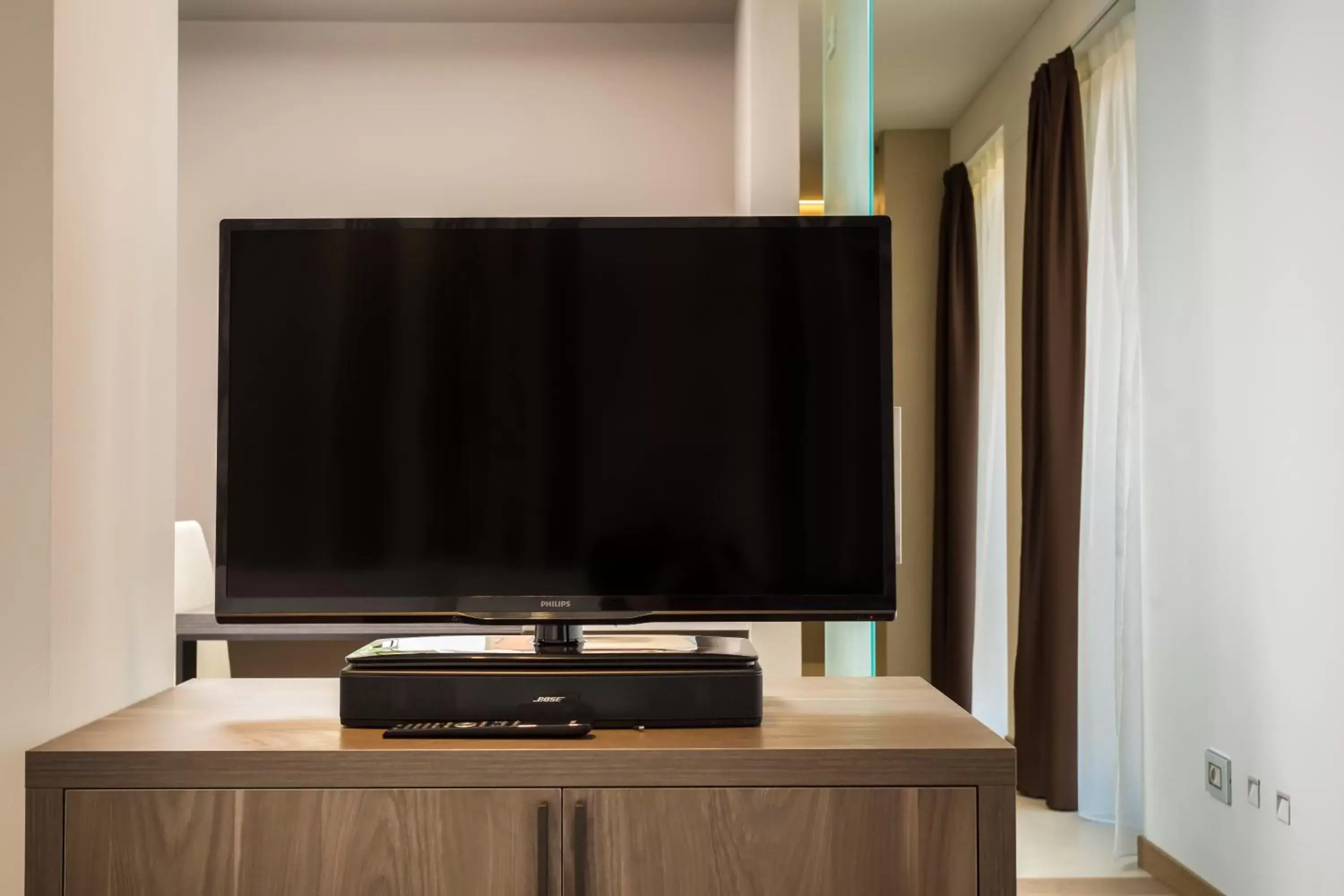 TV and multimedia, TV/Entertainment Center in Suites Hotel Astor