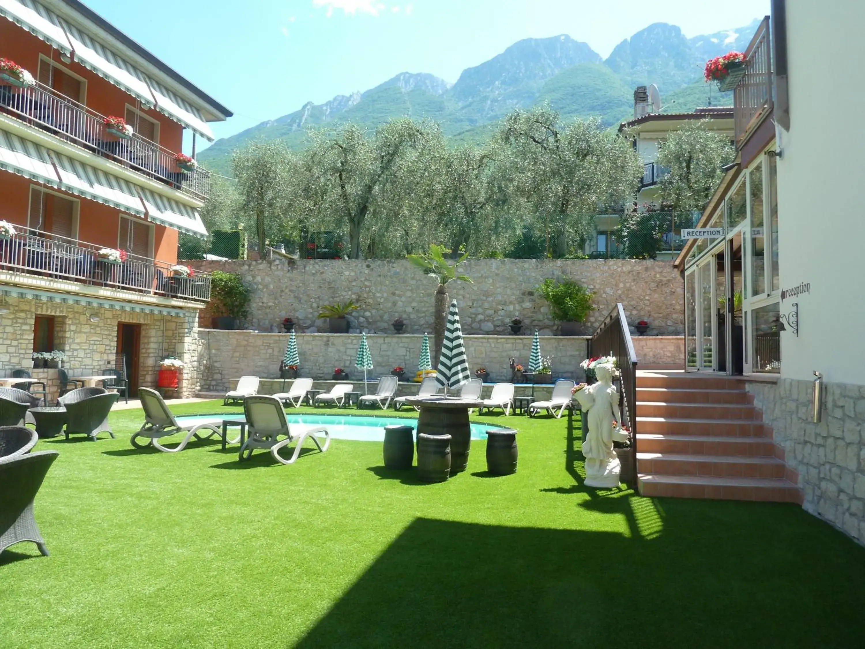 Garden view, Swimming Pool in Albergo Casa Este