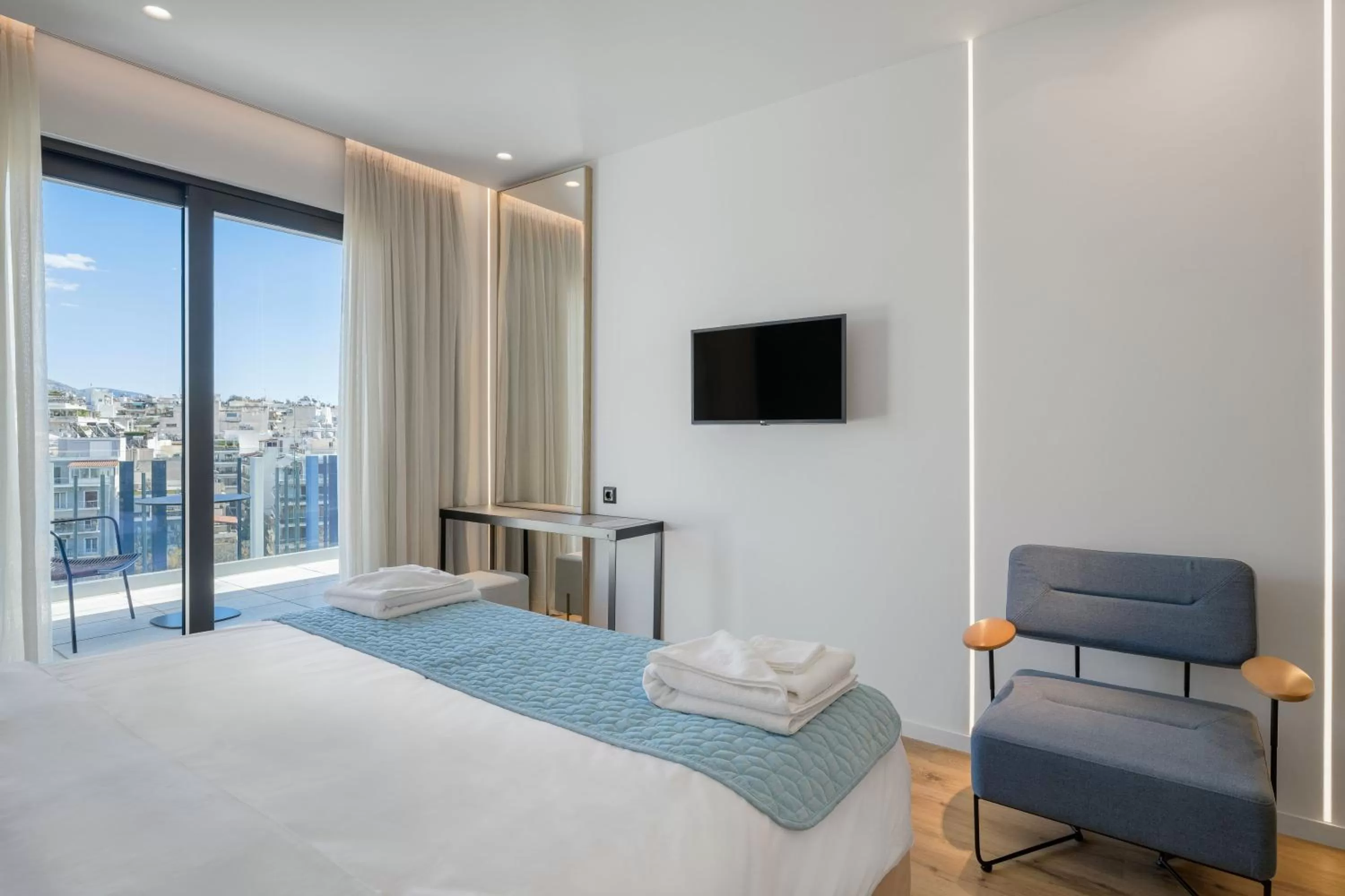 Bed in Acropolis Magenta Luxury Suites