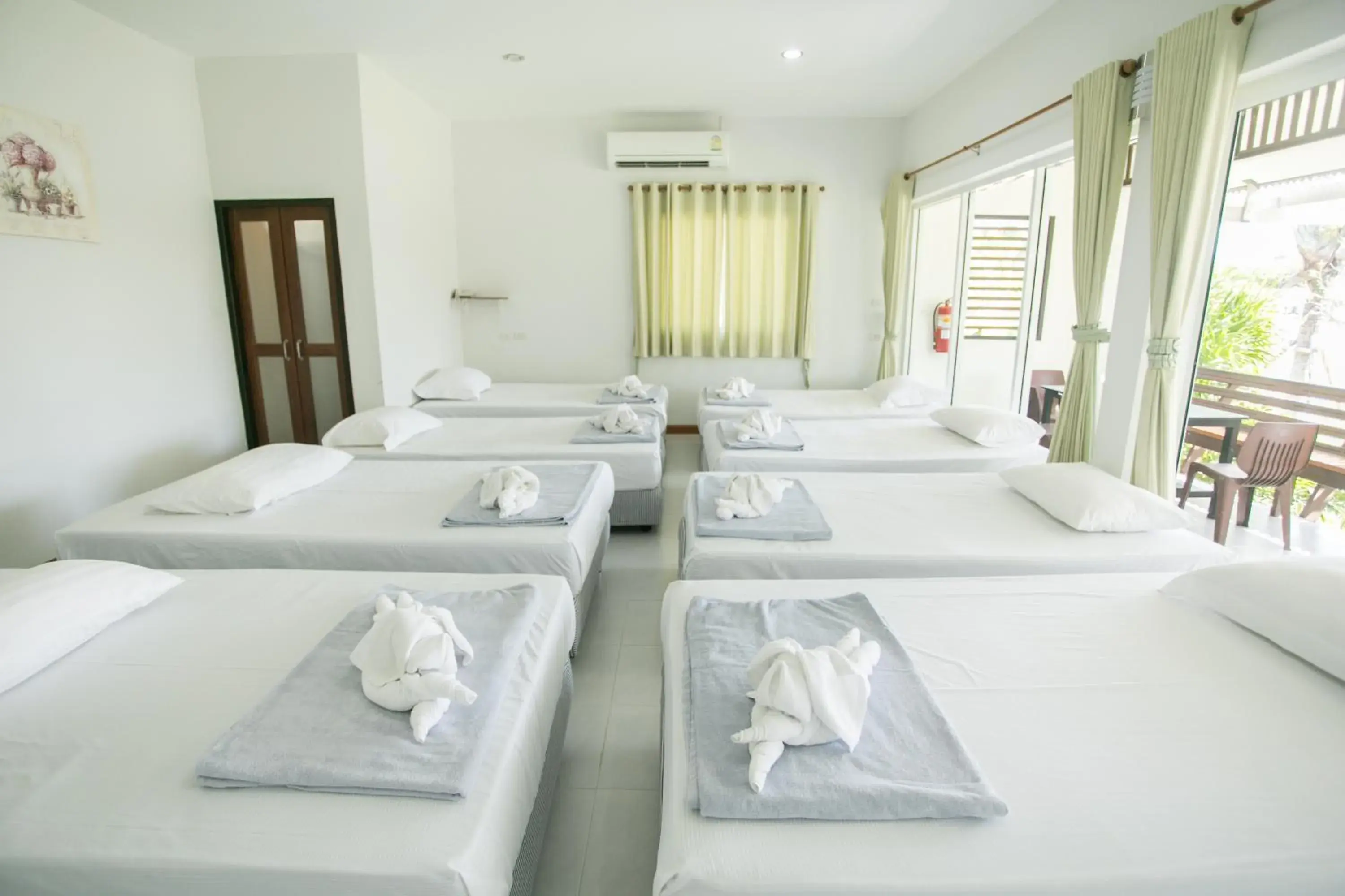 Bed in Nisasiri Boutique Resort