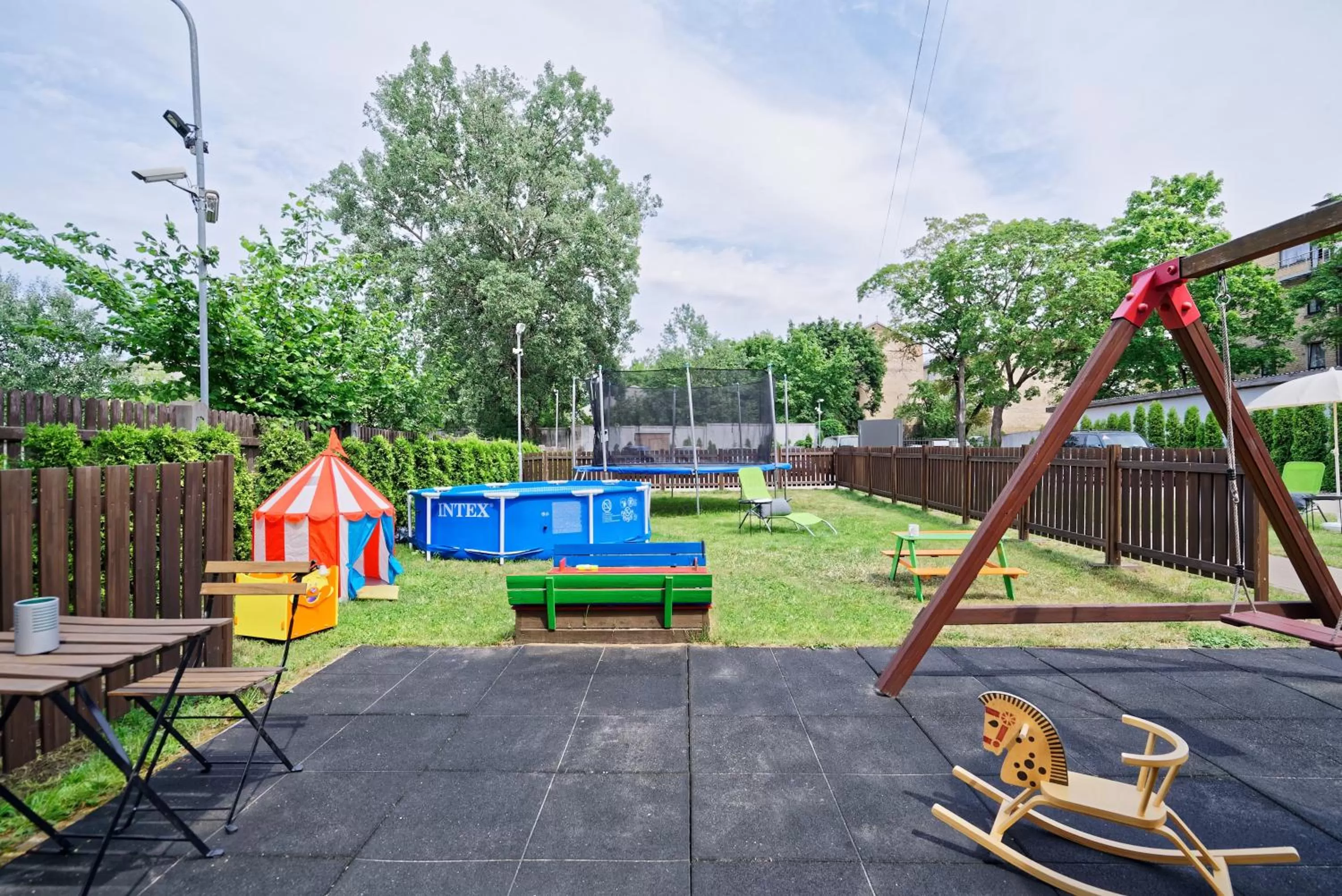 Children play ground in RIGAAPARTMENT SONADA Family Aparthotel - Private Parking