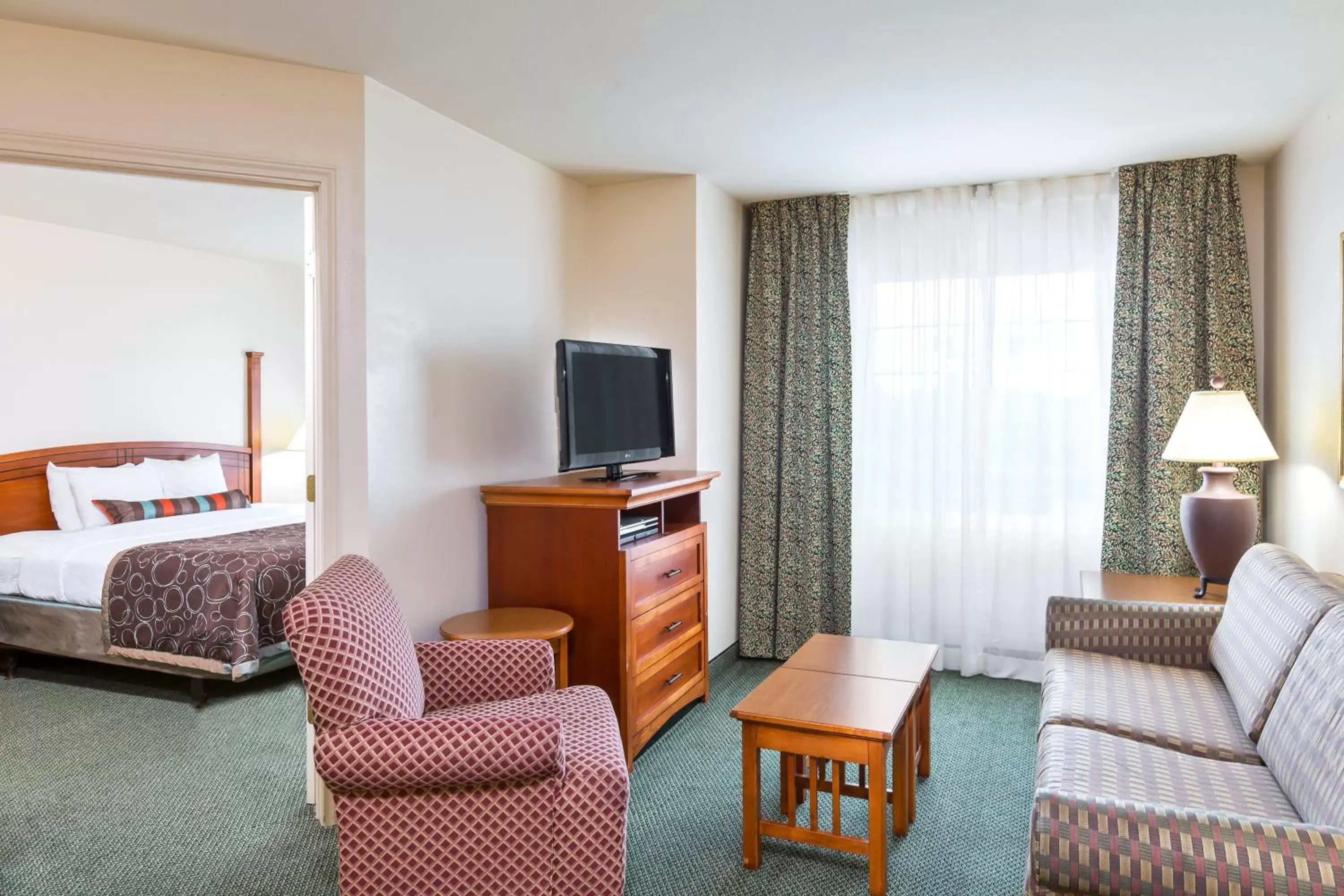 Bedroom, Seating Area in Staybridge Suites - Brownsville, an IHG Hotel