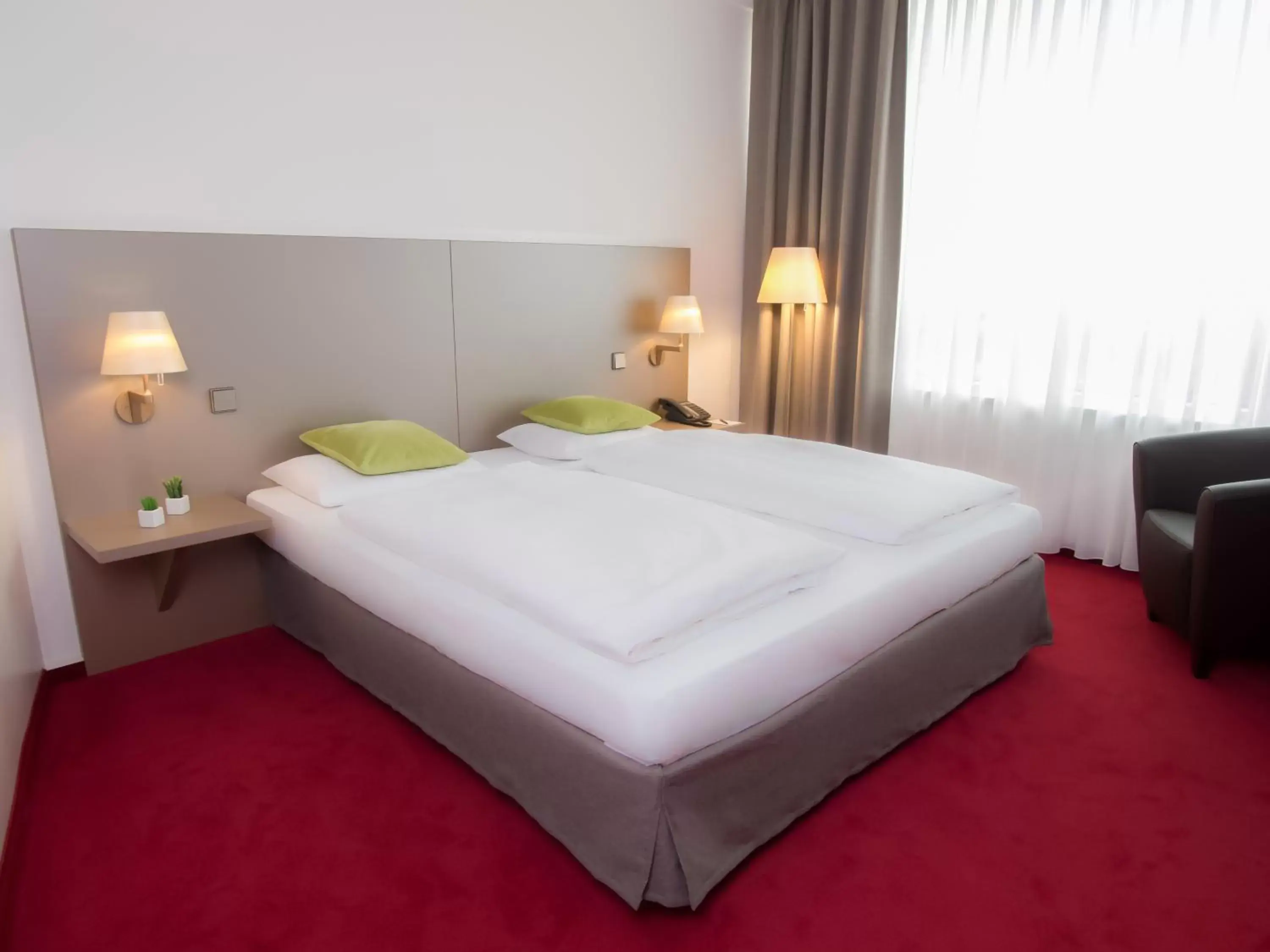 Photo of the whole room, Bed in Lindner Hotel Cottbus