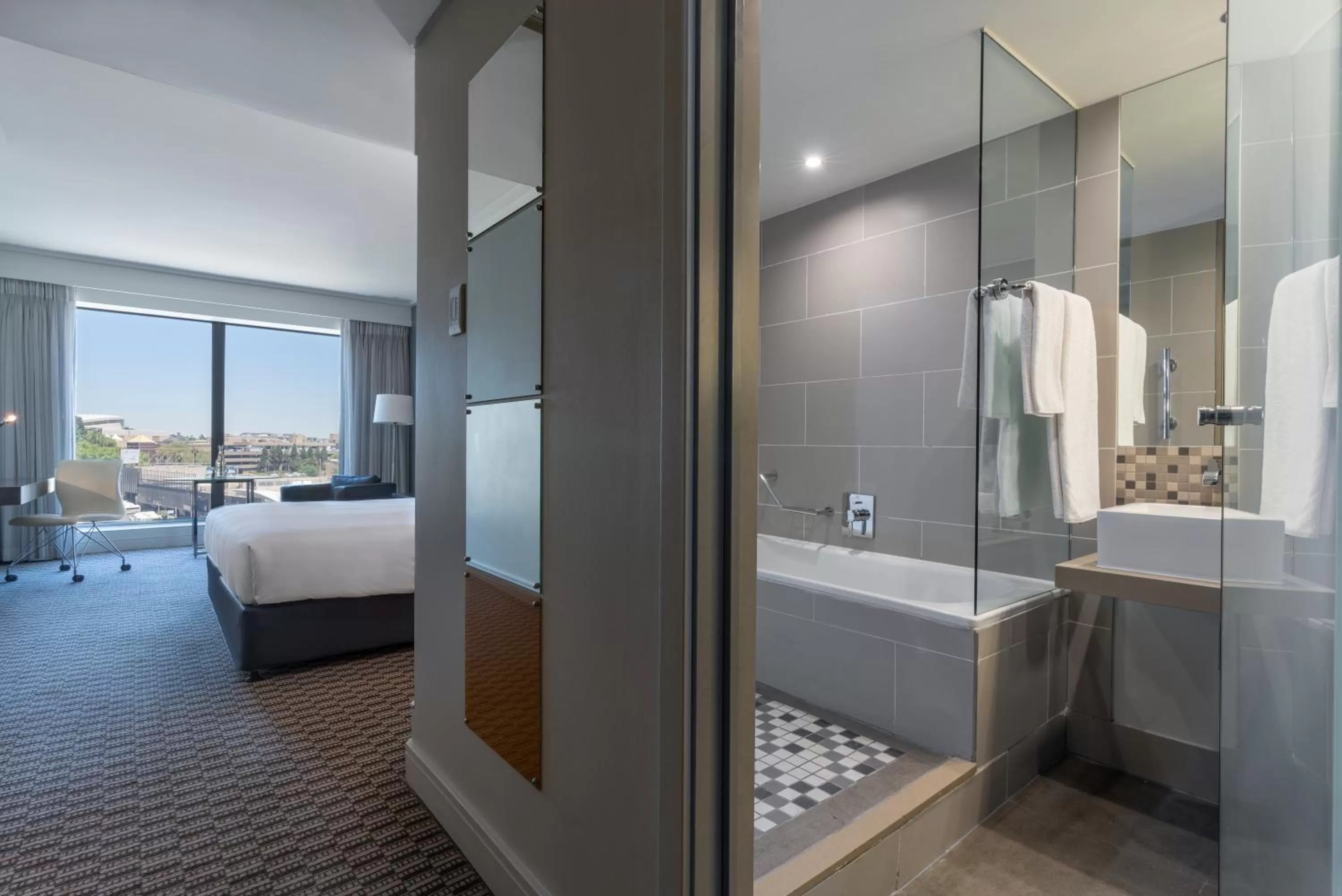 Bathroom, Bed in Radisson Blu Gautrain Hotel, Sandton Johannesburg