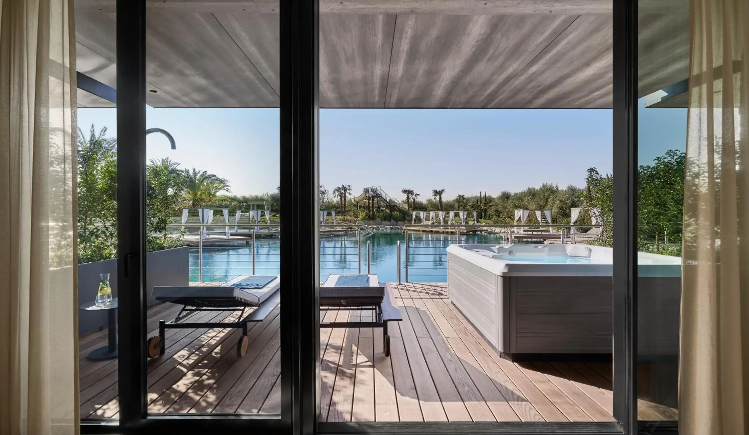 Shower, Pool View in Quellenhof Luxury Resort Lazise