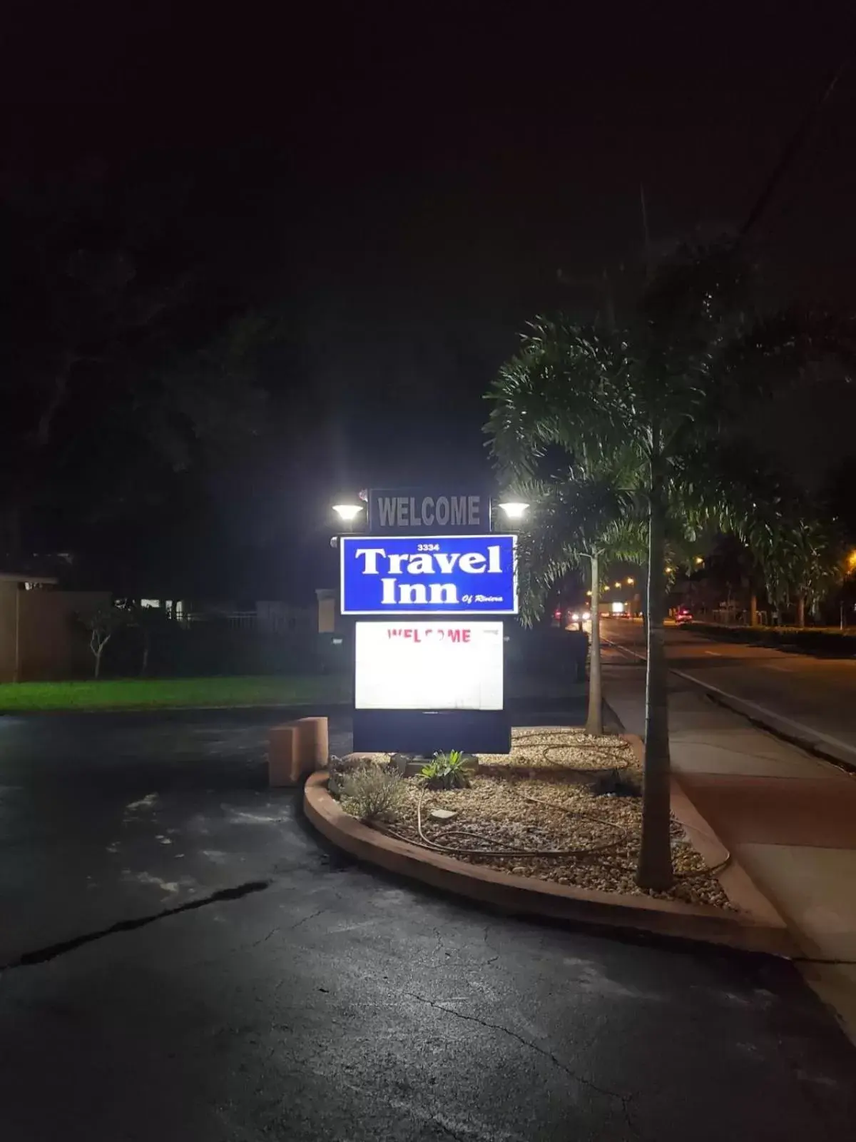 Property logo or sign in Travel Inn of Riviera Beach