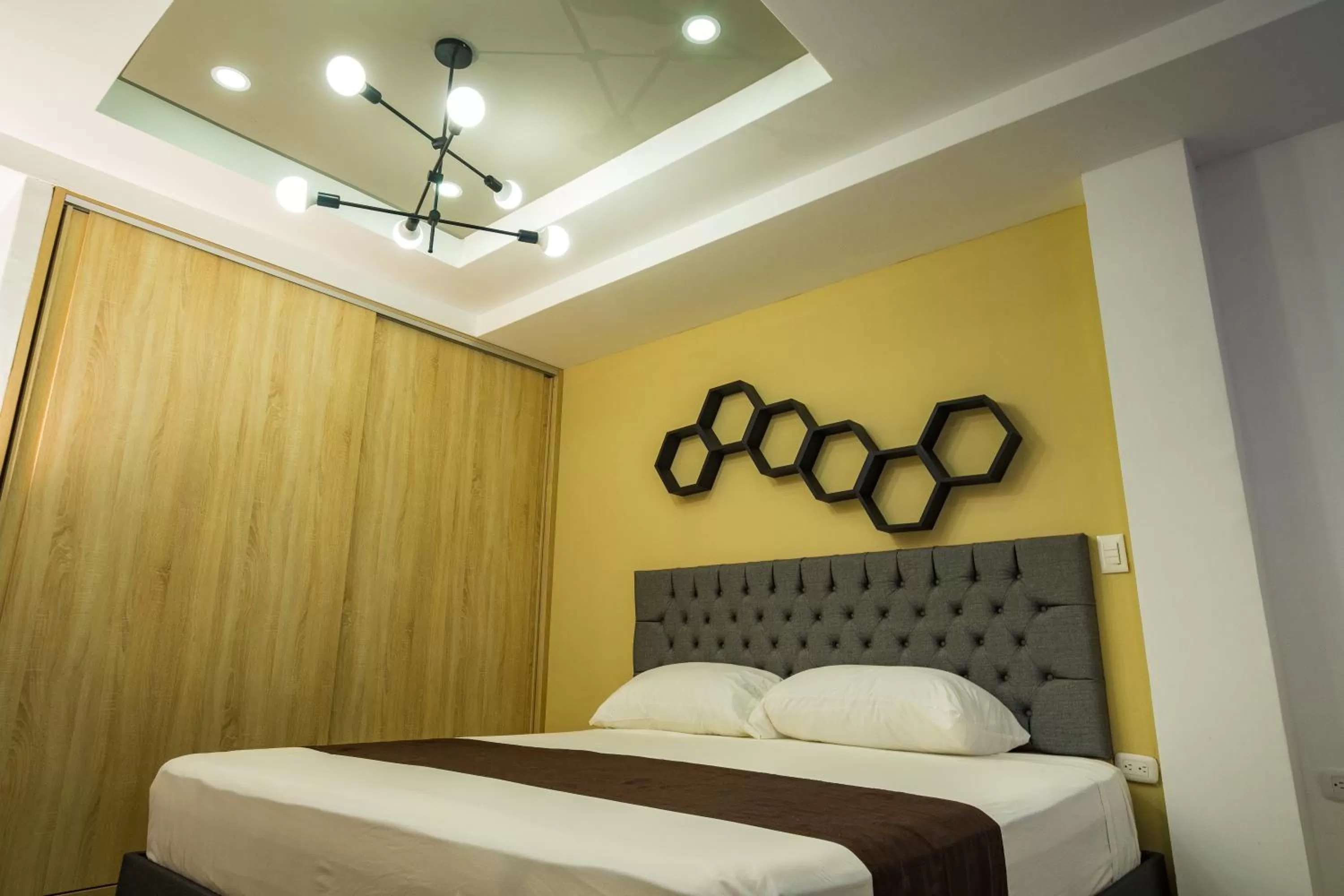 Bed in Genesis Hotel