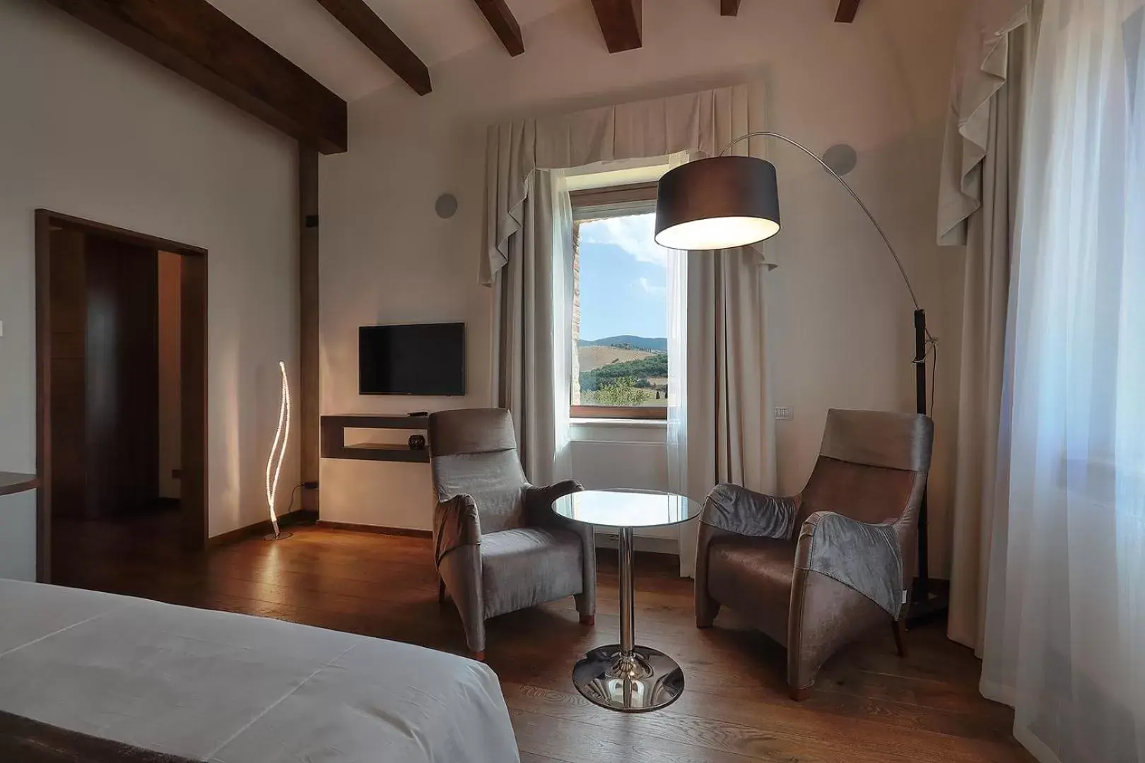 Bed, Seating Area in RELAIS VAL D'ORCIA
