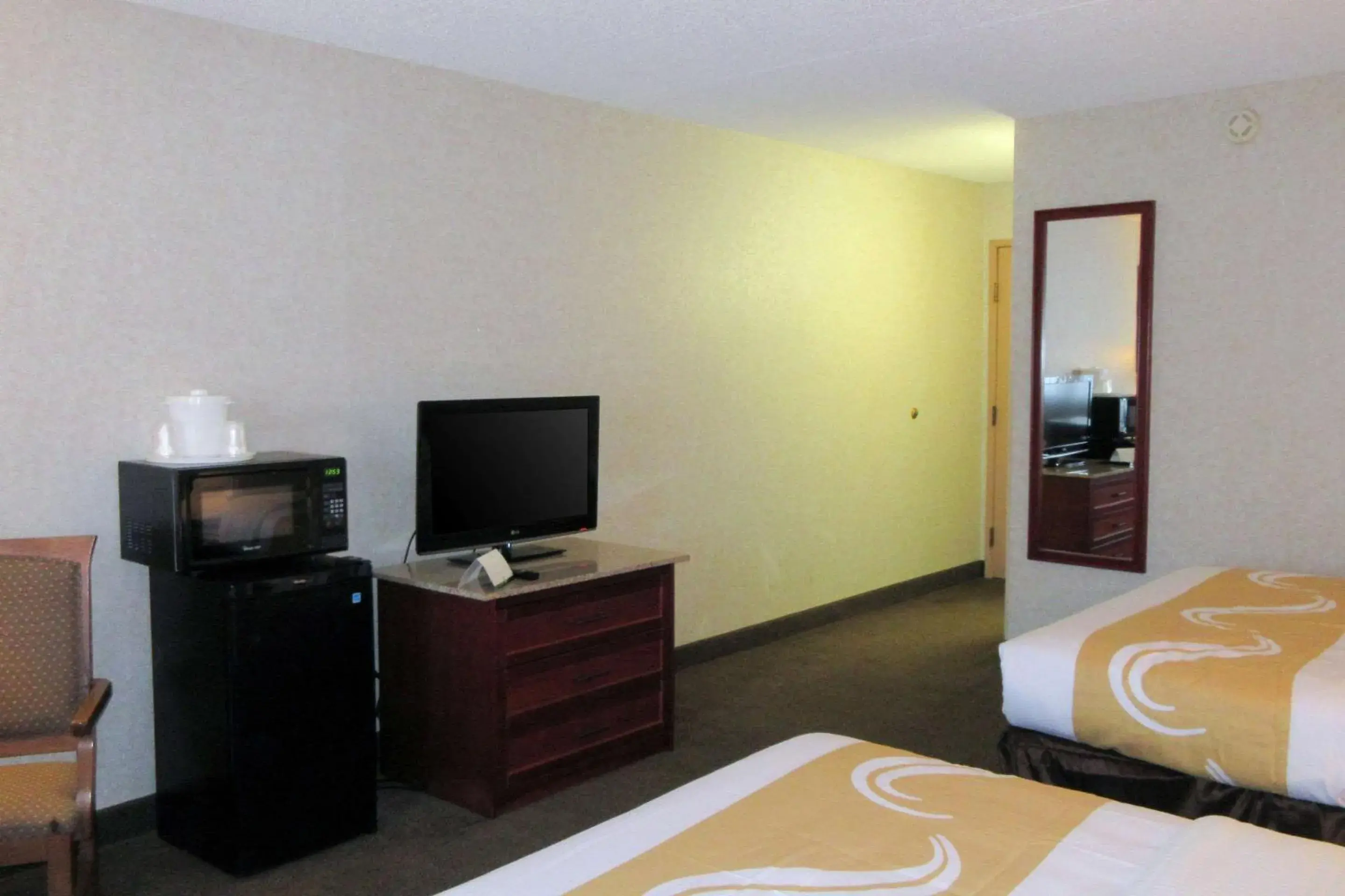 Photo of the whole room, TV/Entertainment Center in Quality Inn & Suites Albuquerque Downtown University