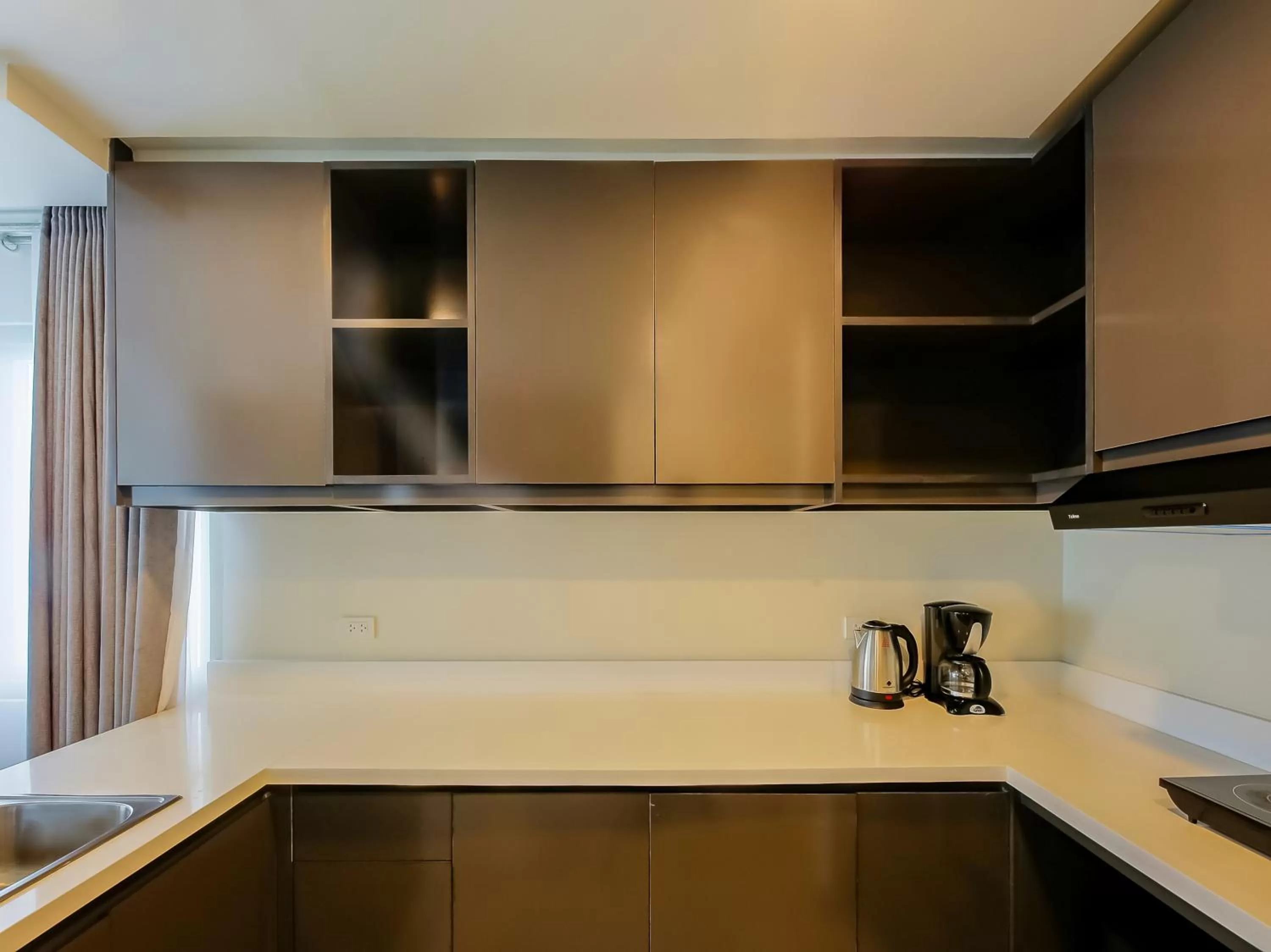 Kitchen or kitchenette, Kitchen/Kitchenette in Capital O 804 The Residences at Bonifacio Civic Center
