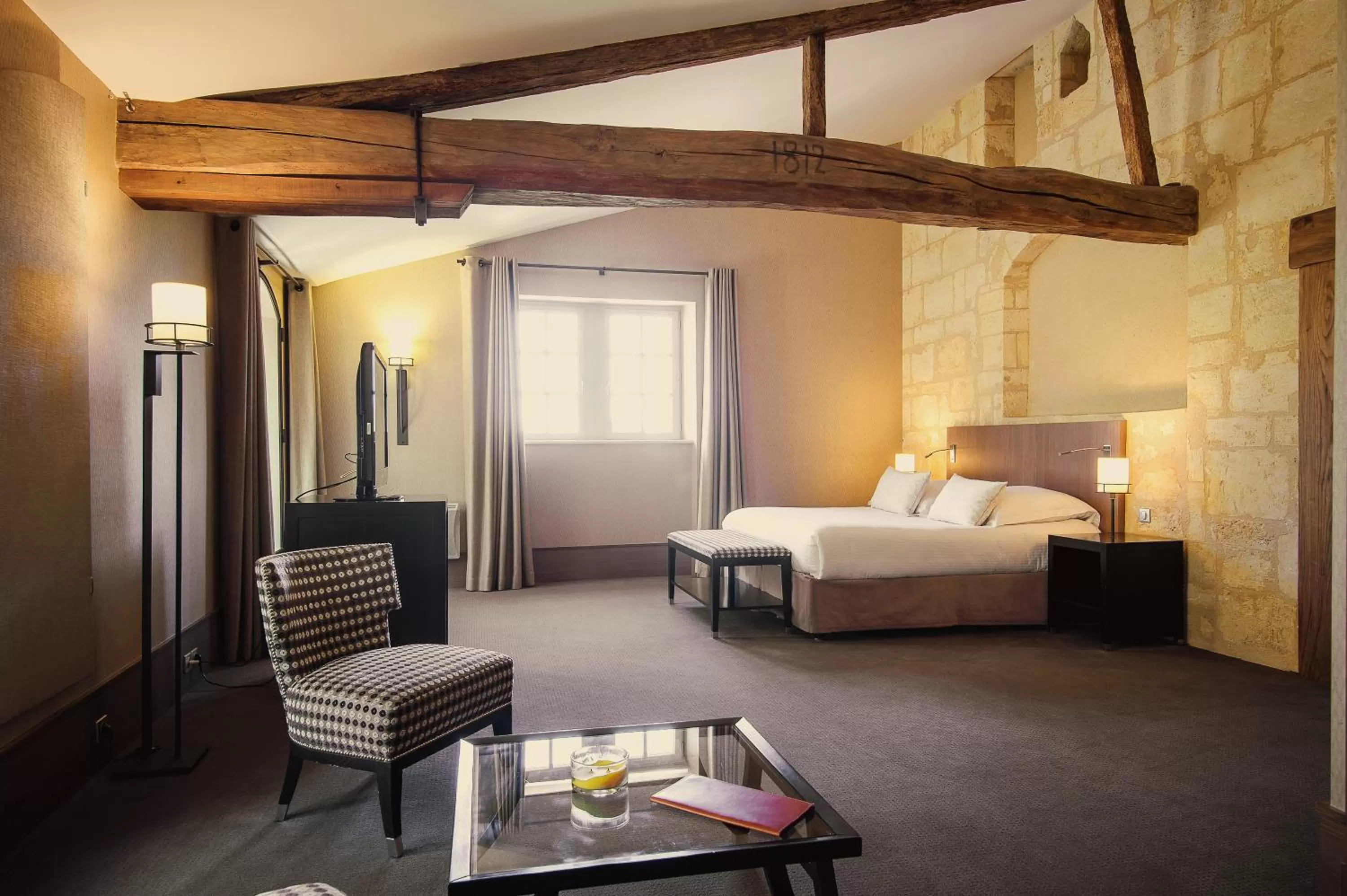 Bedroom in Hôtel Au Logis des Remparts