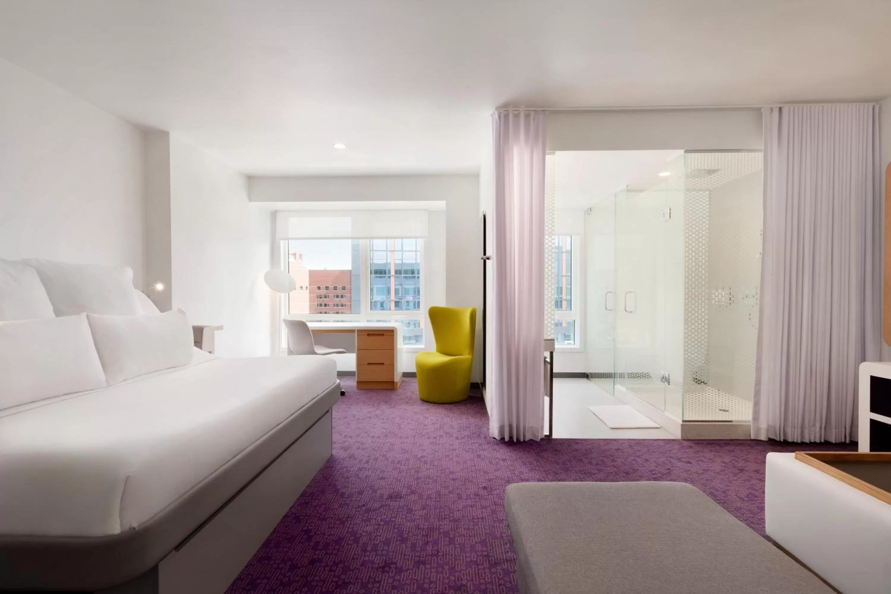 Living room, Bed in YOTEL Boston