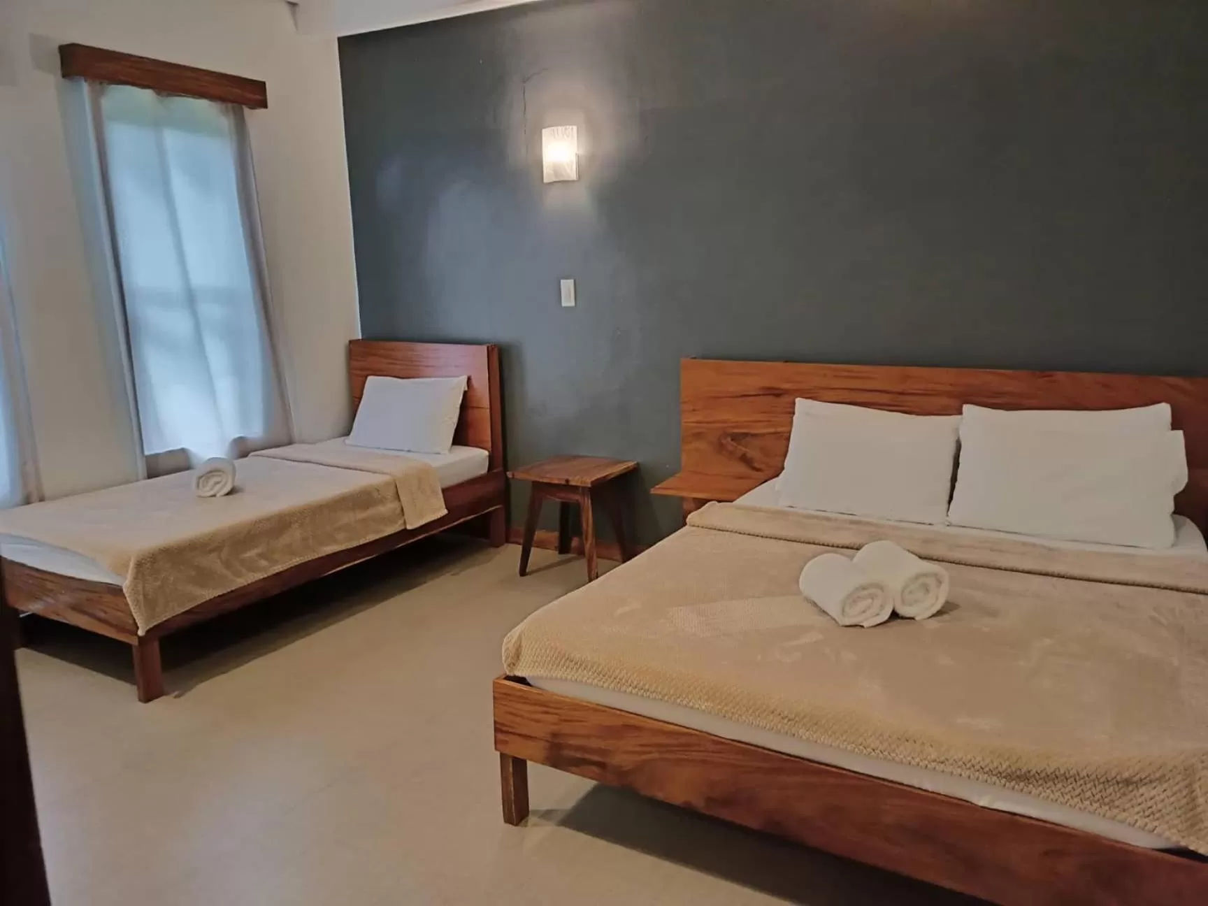 Bed in Acacia Garden Inn and Suites