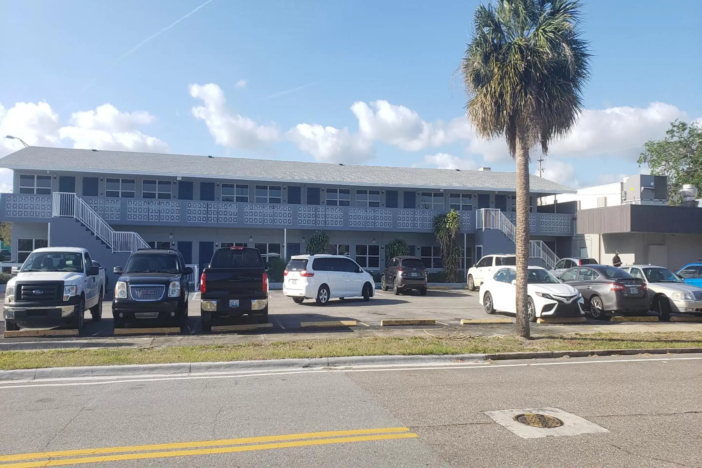 Parking, Property Building in Sunrise Inn by OYO Titusville FL