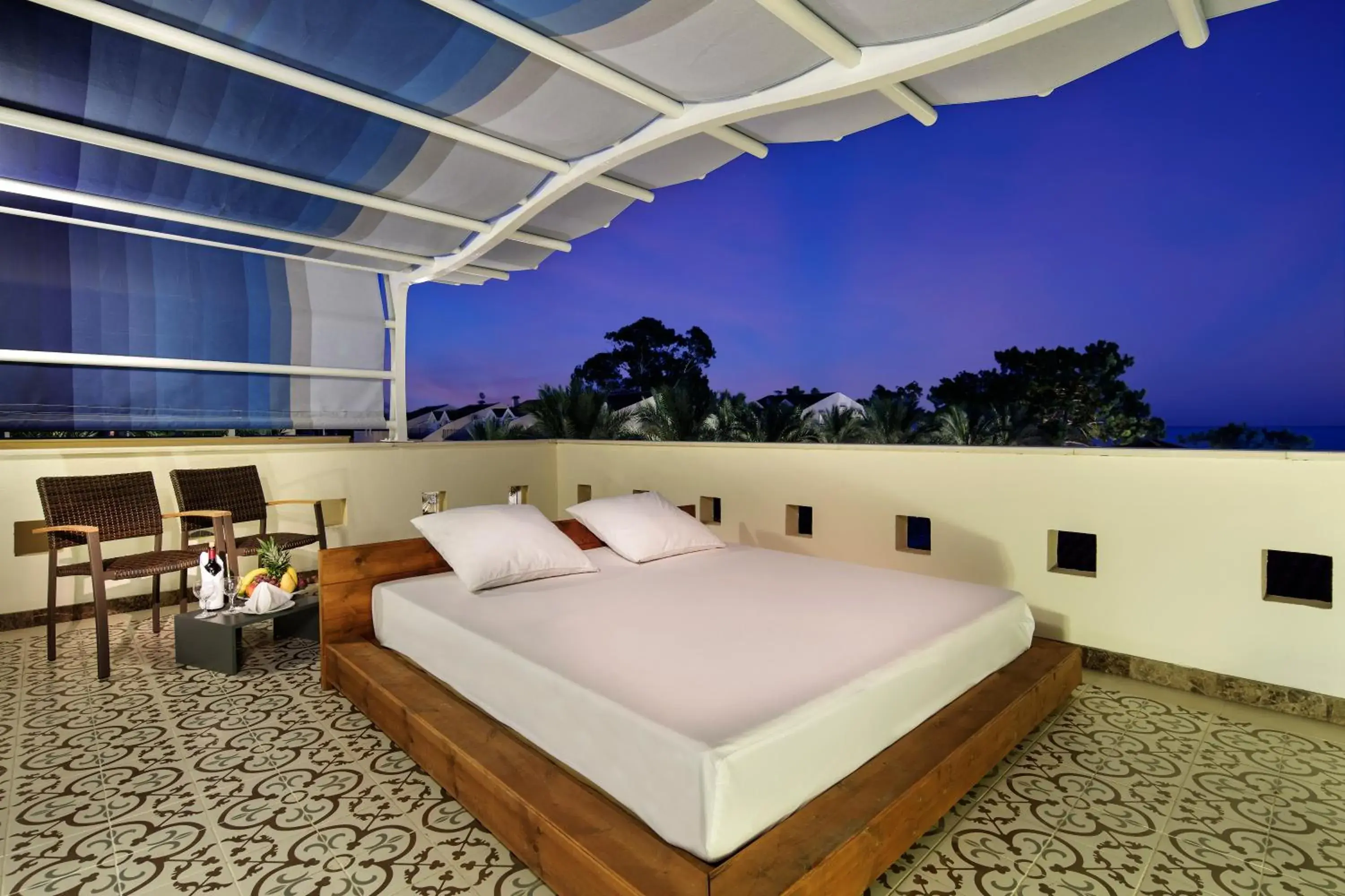 Balcony/Terrace, Bed in Crystal Aura Beach Resort & Spa