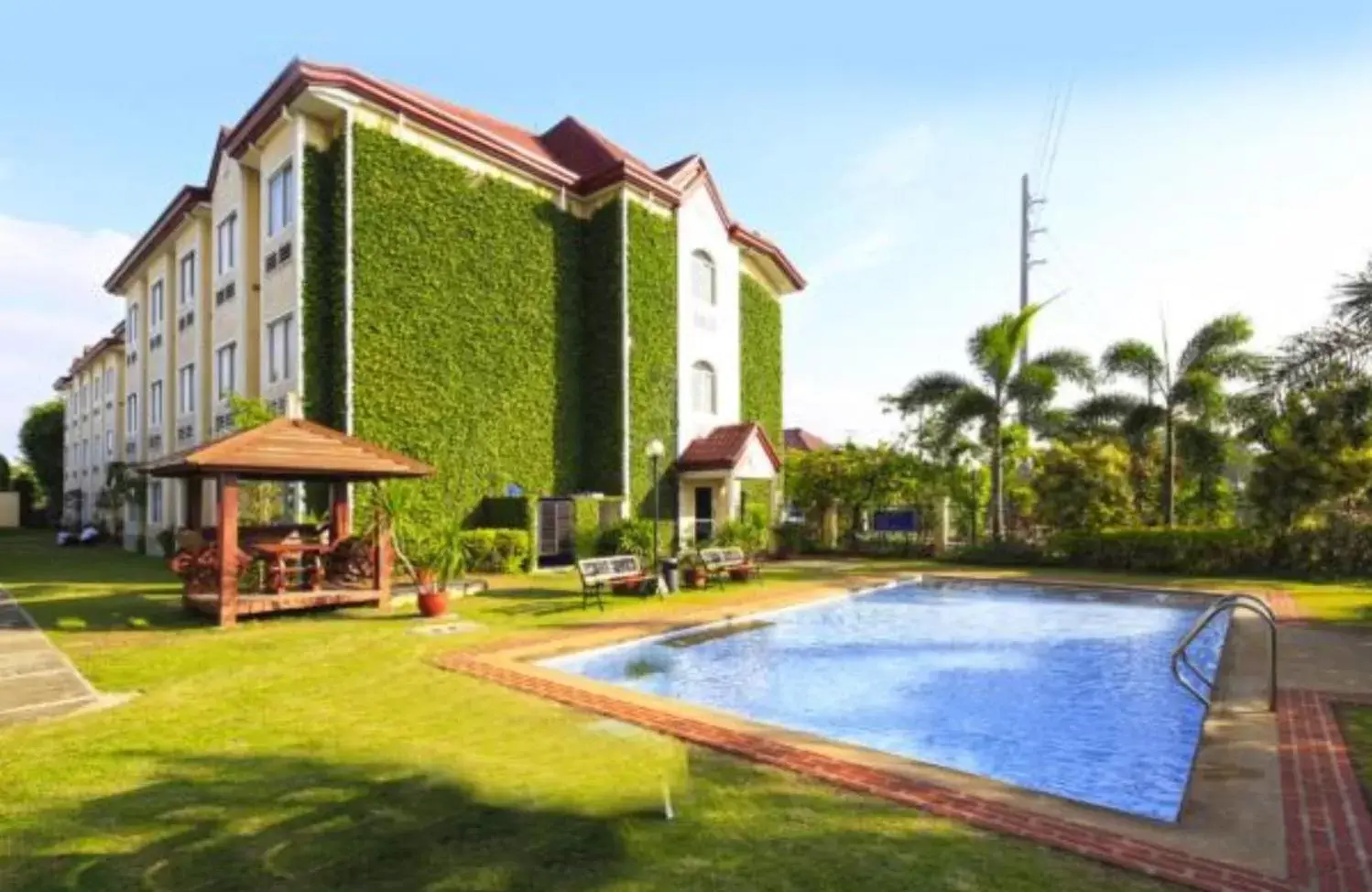 Swimming pool, Property Building in Microtel by Wyndham Batangas