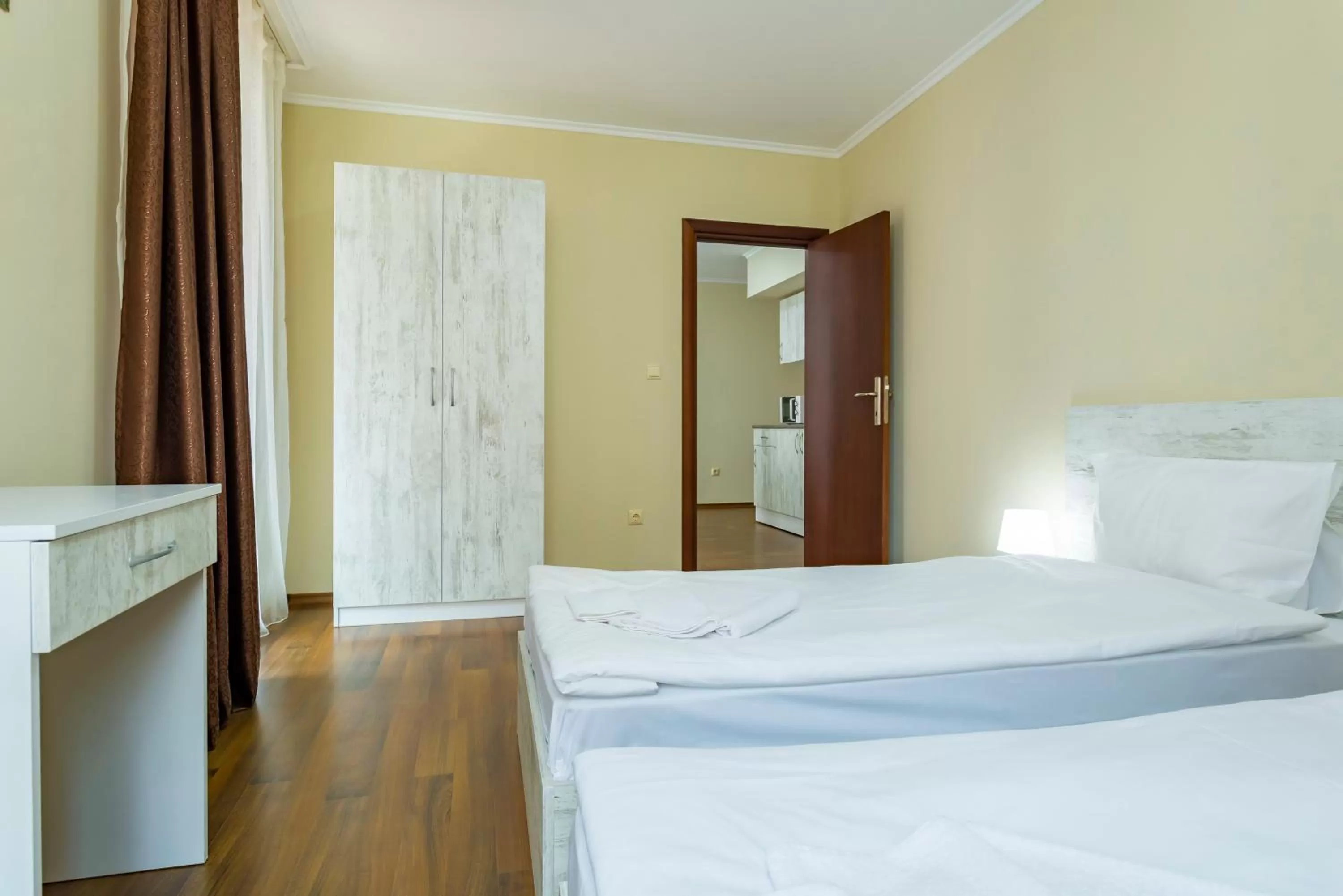 Bed in Rose Gardens Apart Hotel