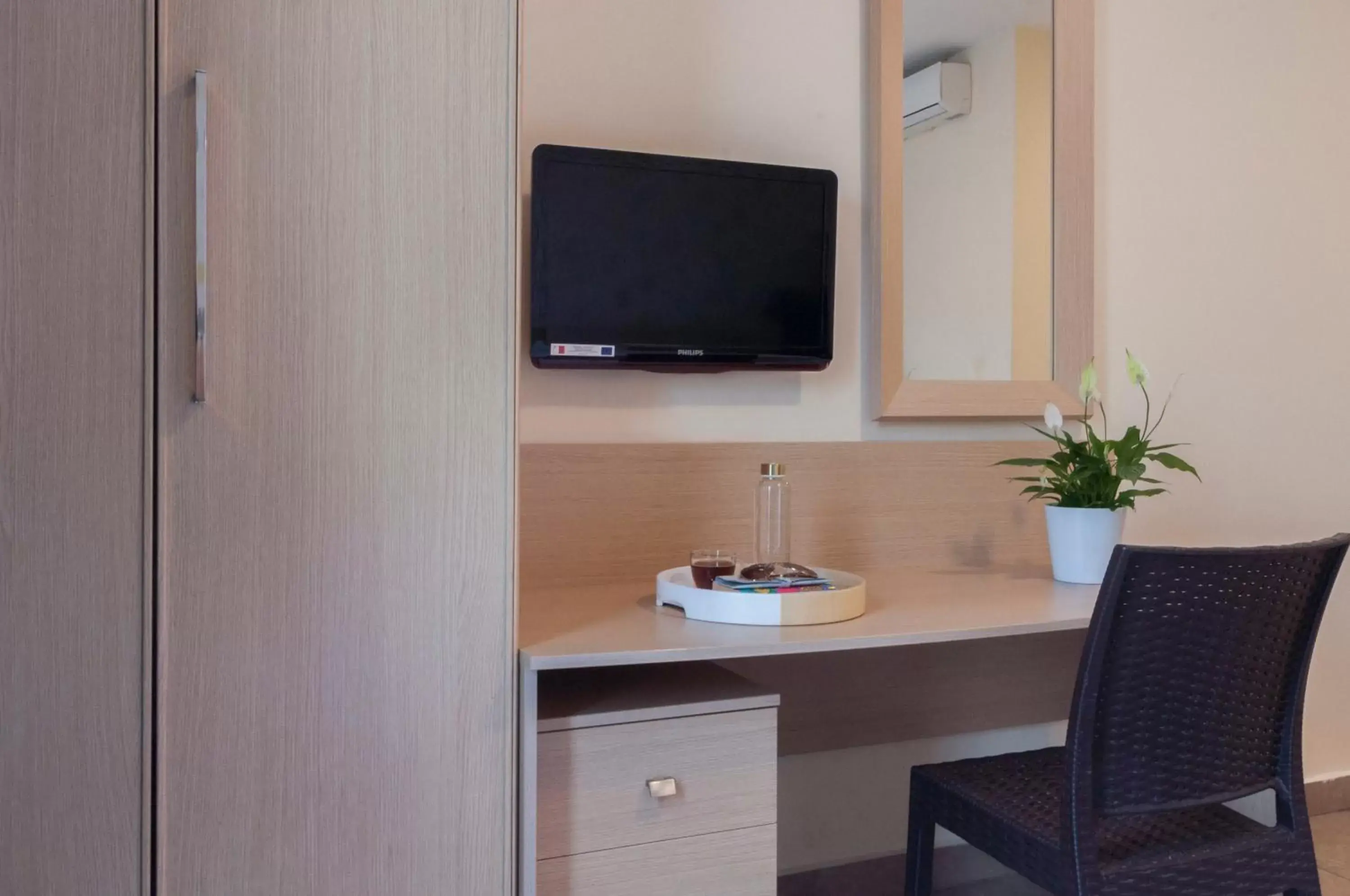Bedroom, TV/Entertainment Center in Blubay Apartments by ST Hotels