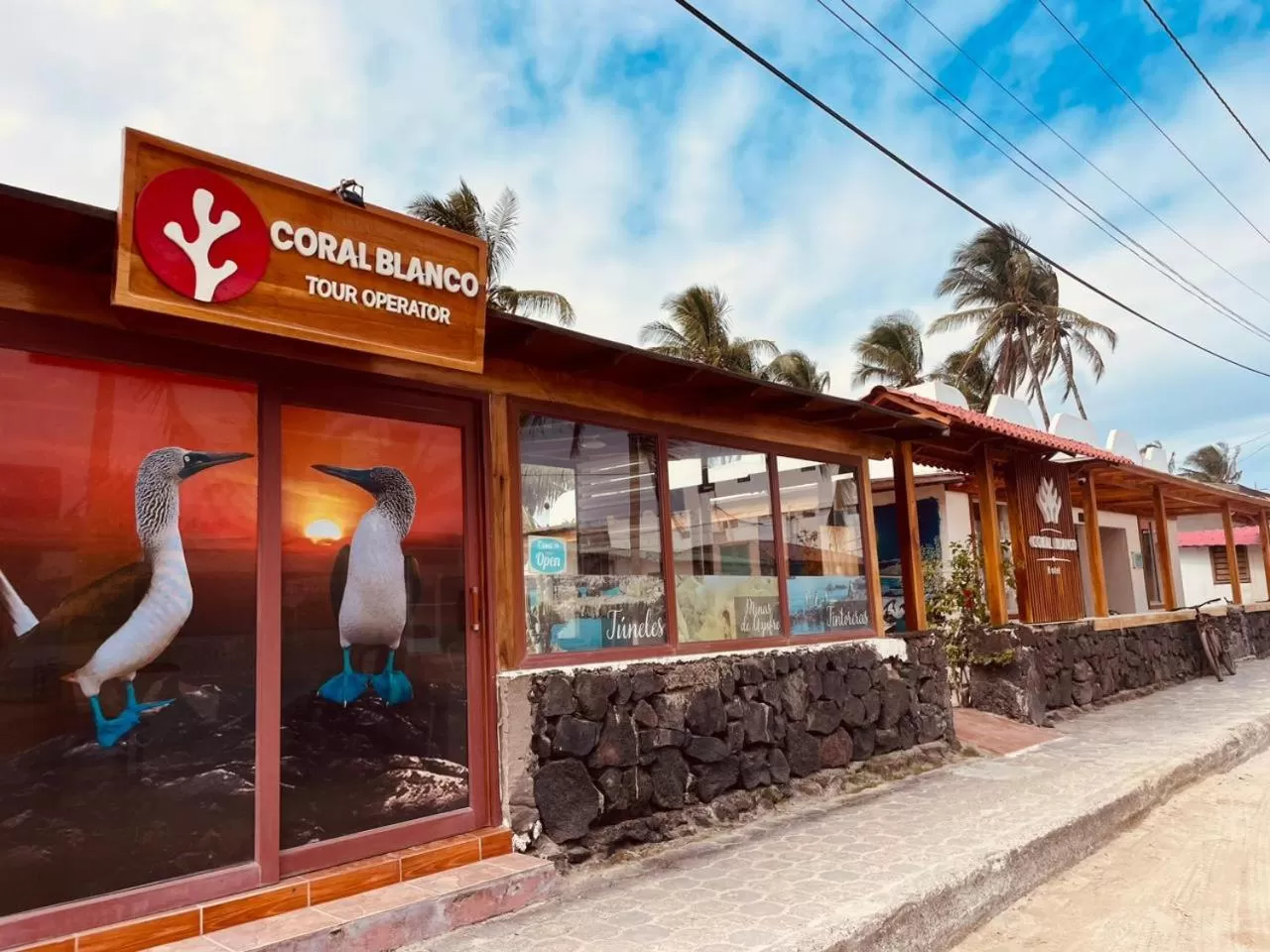 Property logo or sign in Hotel Coral Blanco with high speed internet Starlink and Galapagos Tour Operator