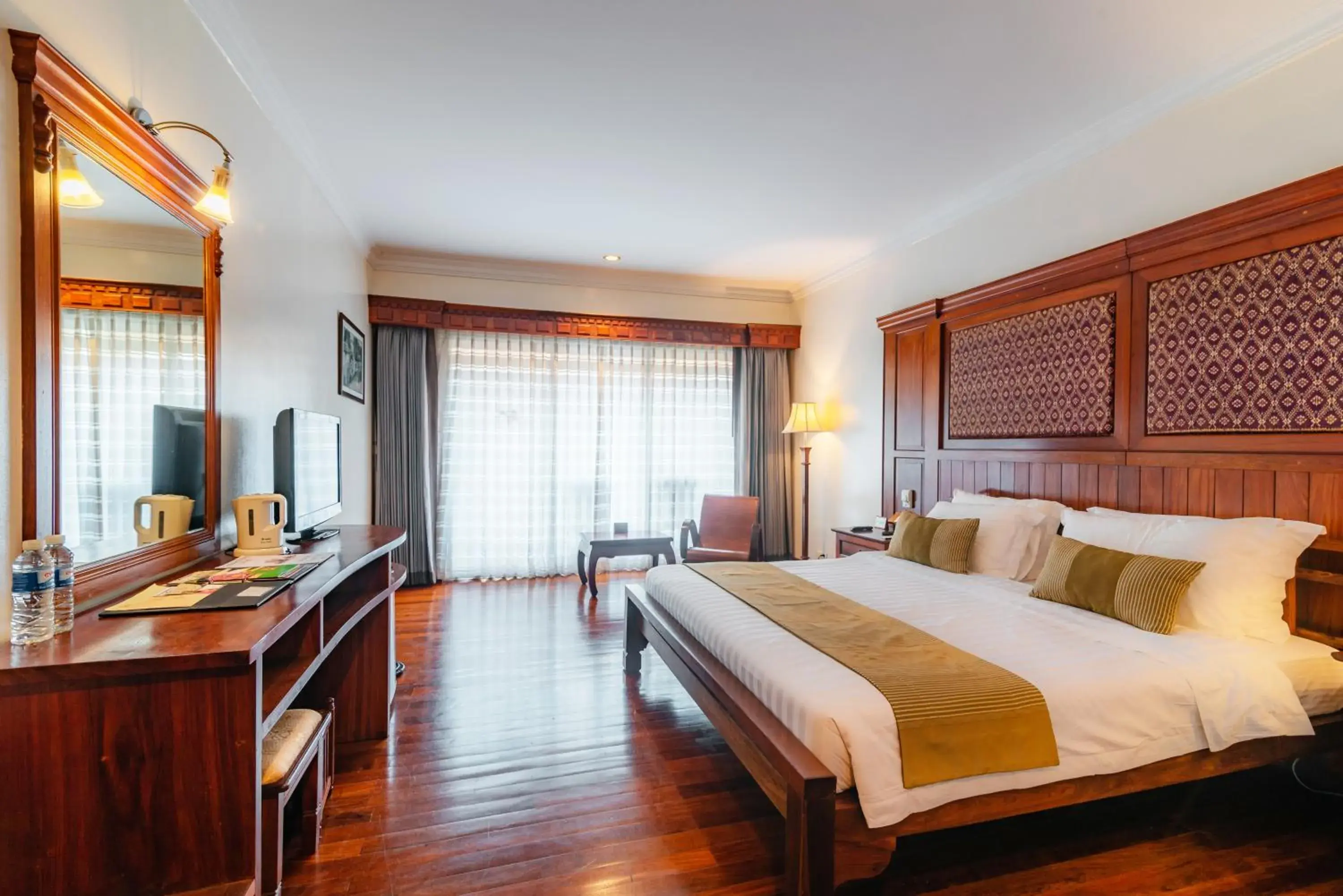 Bed in Empress Angkor Resort & Spa