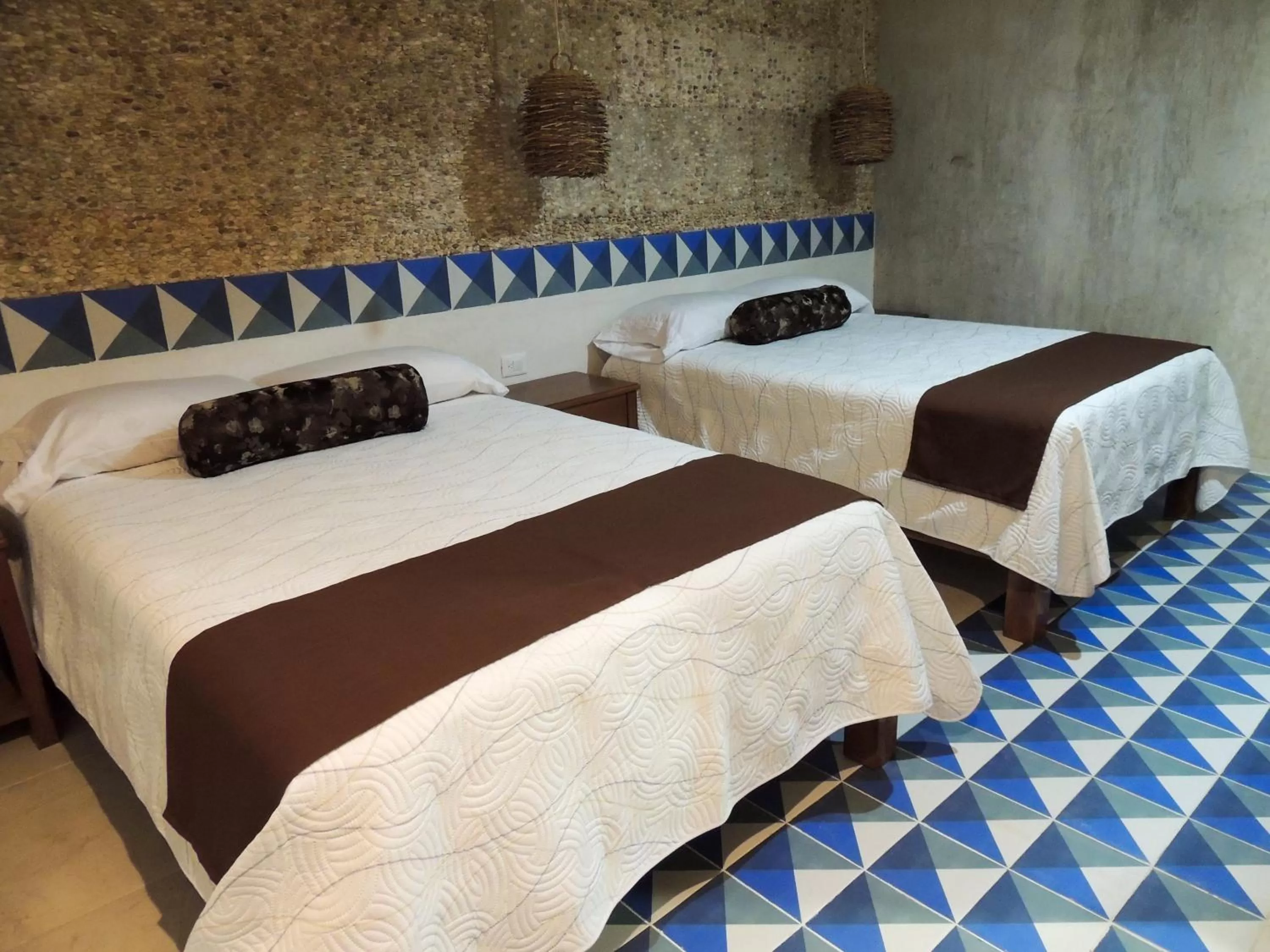 Bed in Hotel Boutique Bugambilias