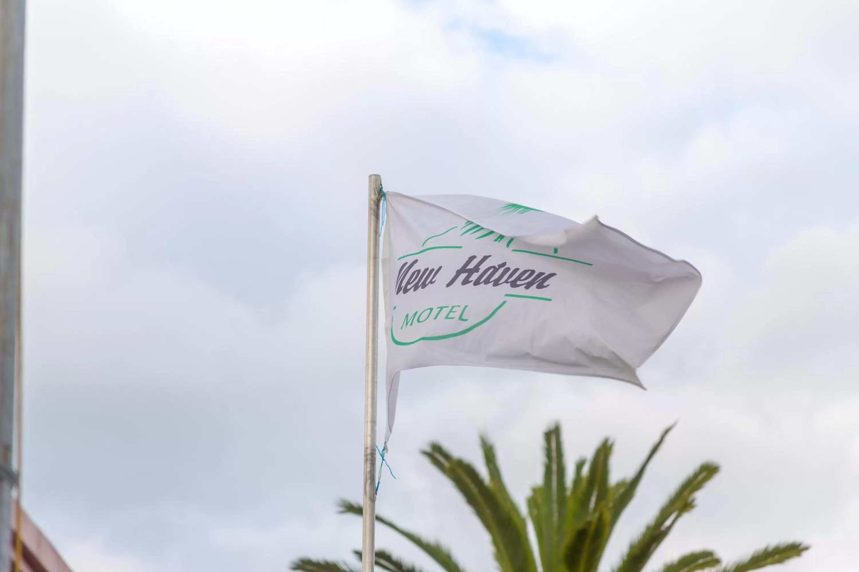 Property logo or sign in New Haven Motel