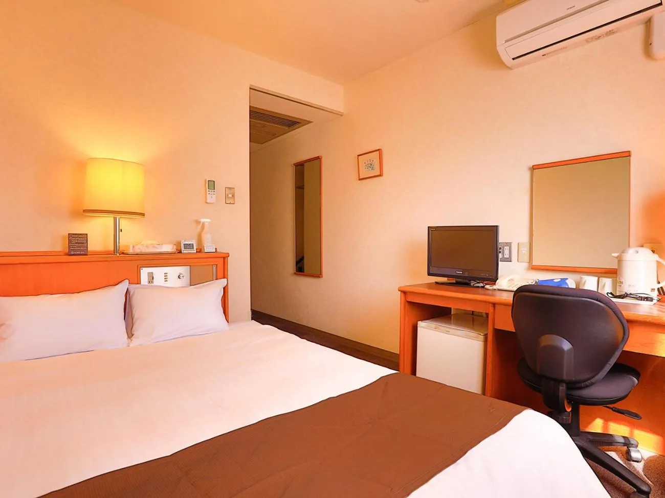 Bed in Kochi Sunrise Hotel