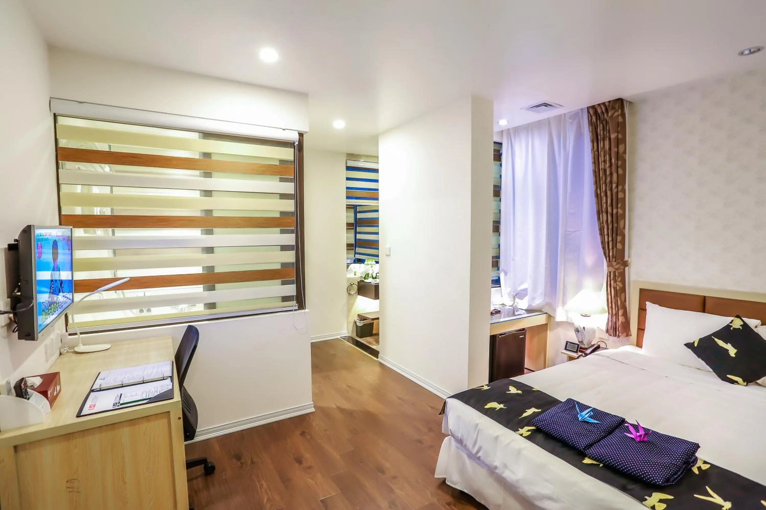 Bed in Momizi Business Hotel