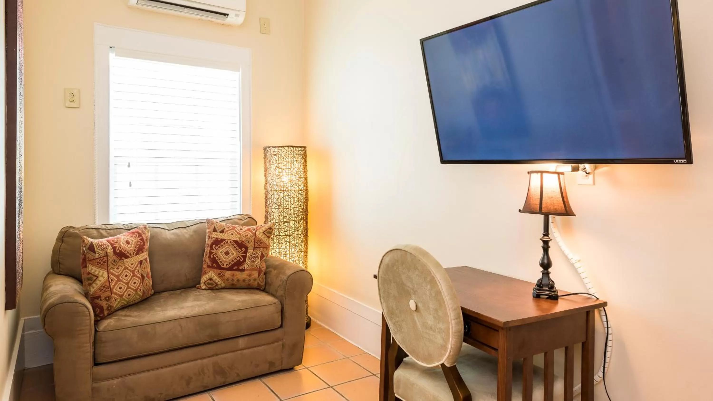 TV/Entertainment Center in L'Habitation Guesthouse- Adult Exclusive