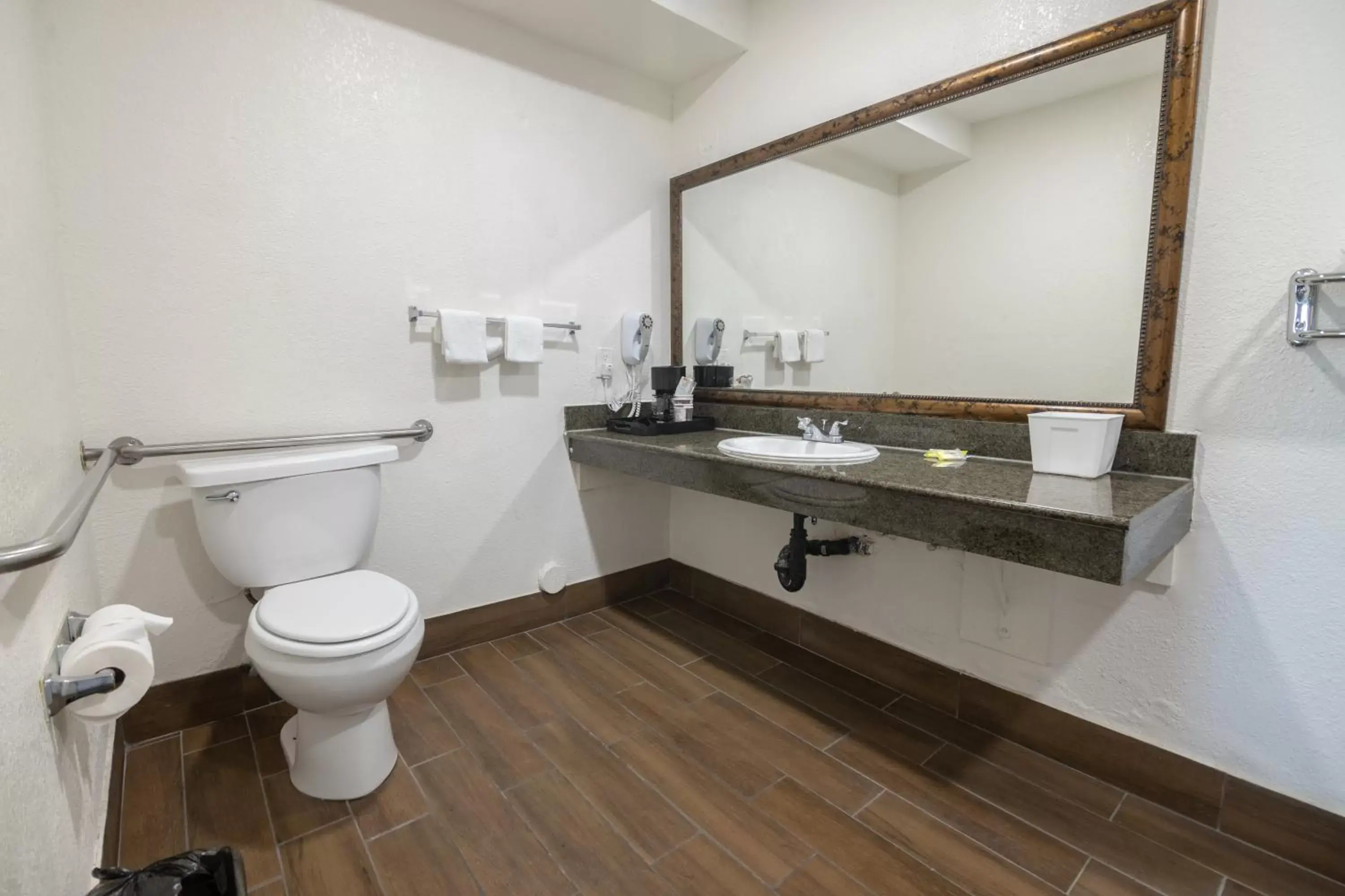 Toilet, Bathroom in Hospitality Inn