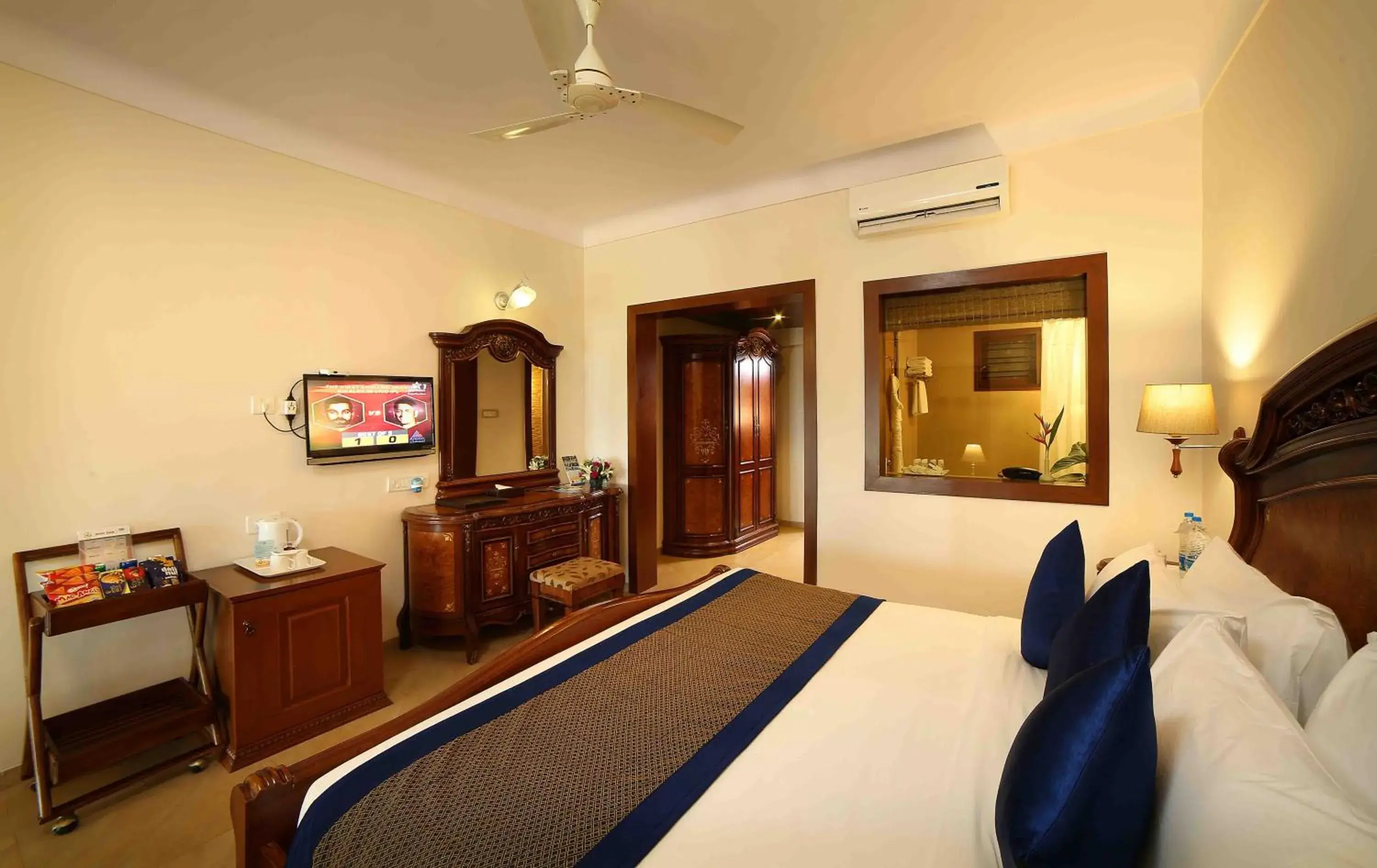 Bedroom, TV/Entertainment Center in Uday Samudra Leisure Beach Hotel
