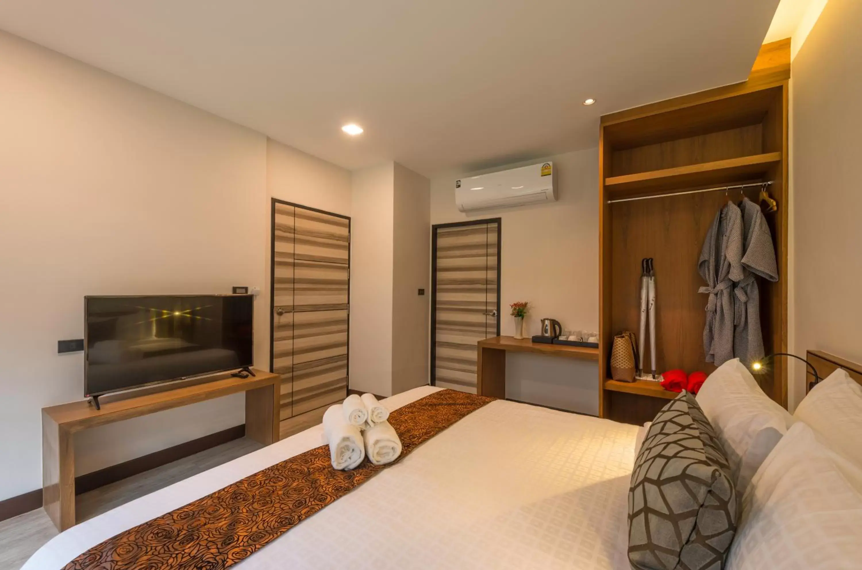 Bed in Cher​mantra​ Aonang​ Resort & Pool​ Suite