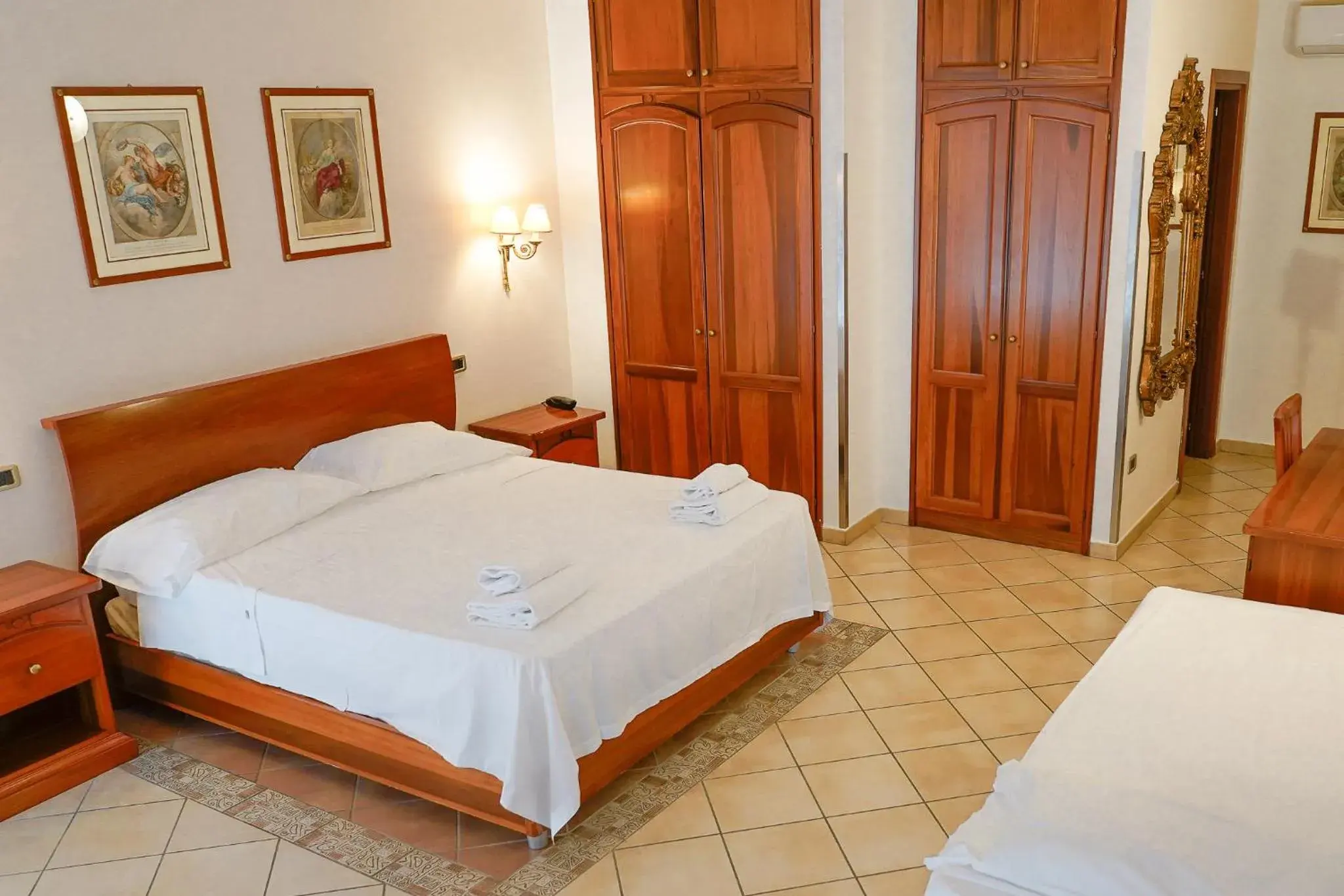 Family Room (4 Adults) in Hotel Ristorante Garibaldi Family Room (4 Adults) in Hotel Ristorante Garibaldi