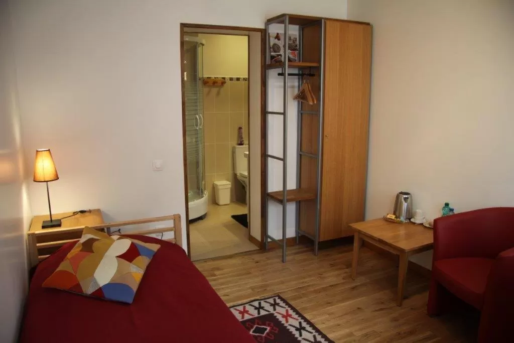 Photo of the whole room, Bed in Hôtel Les Charmilles de Mormal