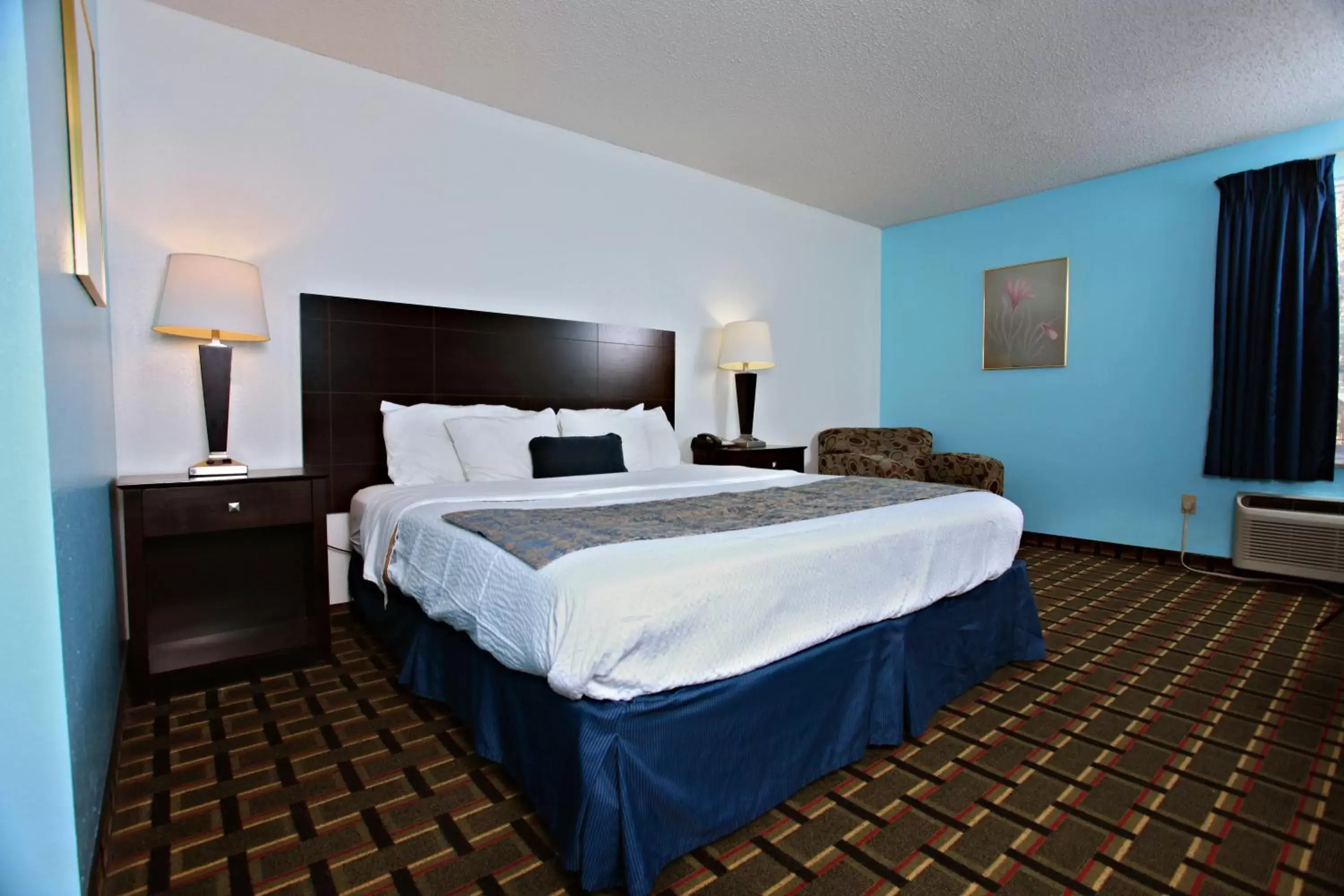 Bed in Coratel Inn & Suites by Jasper Newton