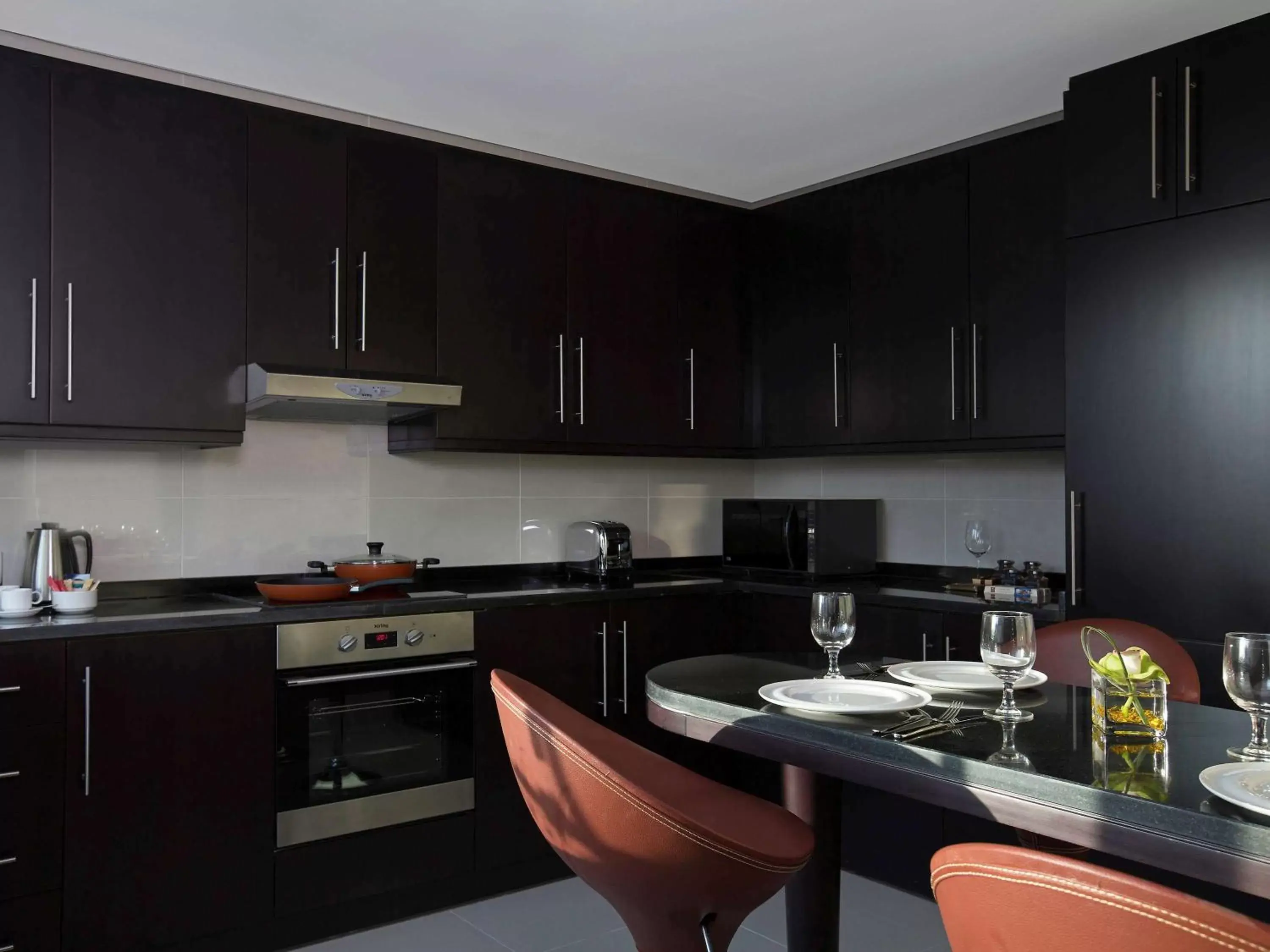 Photo of the whole room, Kitchen/Kitchenette in Pullman Dubai Jumeirah Lakes Towers