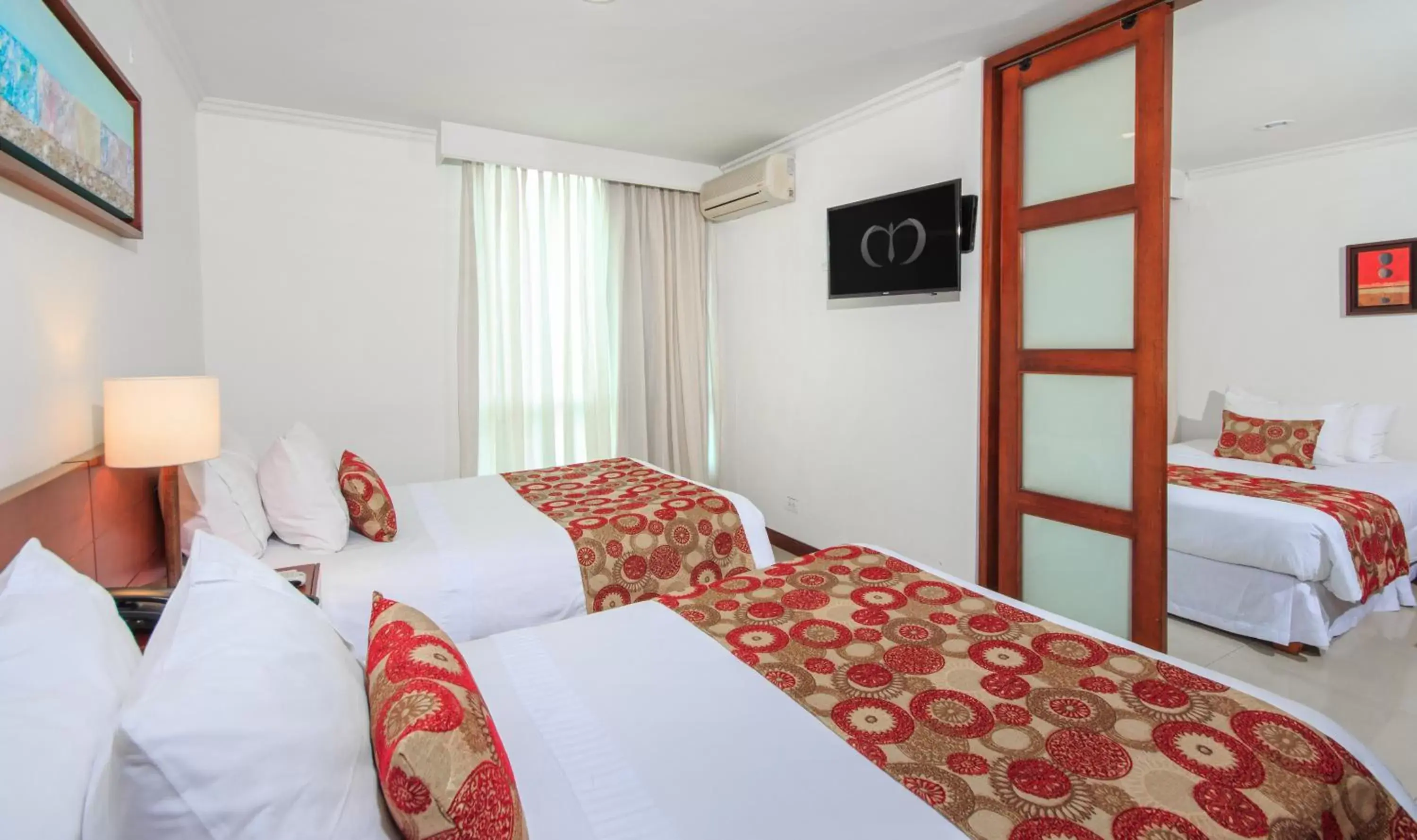 Bed in The Morgana Poblado Suites Hotel