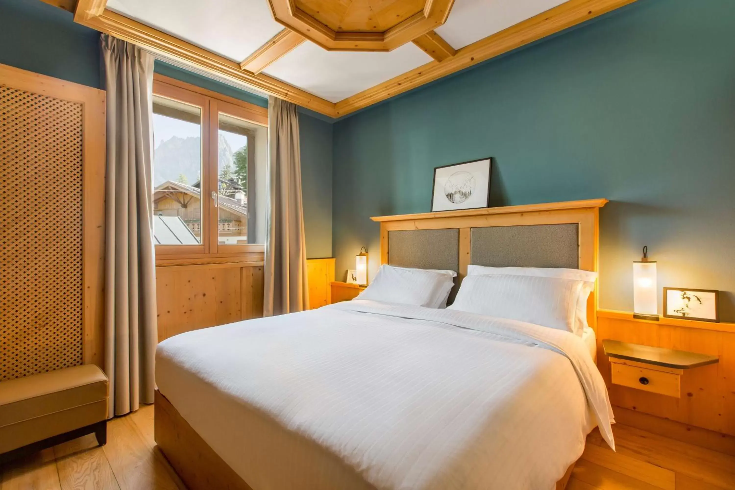 Photo of the whole room, Bed in Radisson Residences Savoia Palace Cortina d’Ampezzo