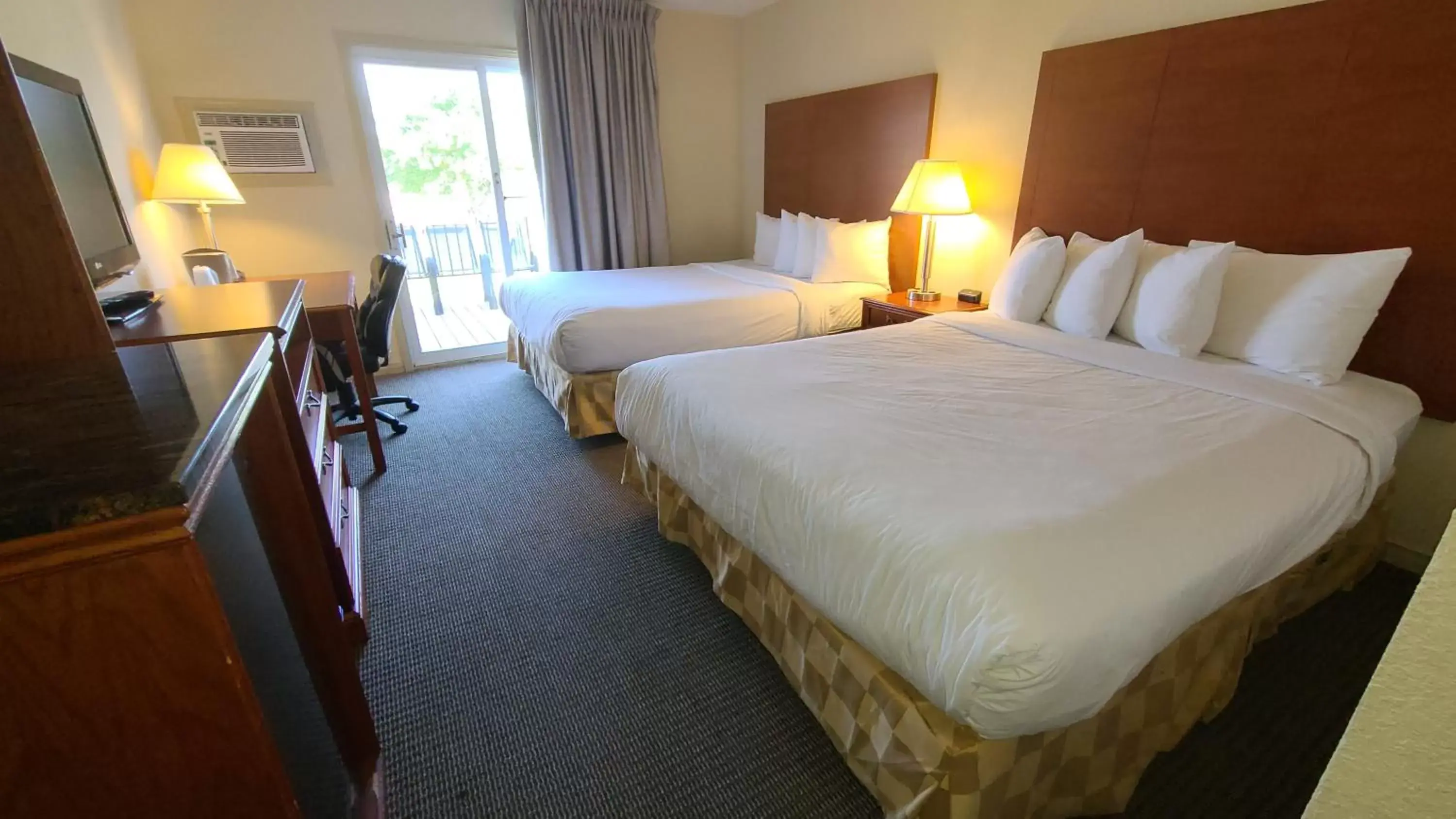 Queen Room with Two Queen Beds and Pool View -  Non-Smoking in Travelodge by Wyndham Gananoque